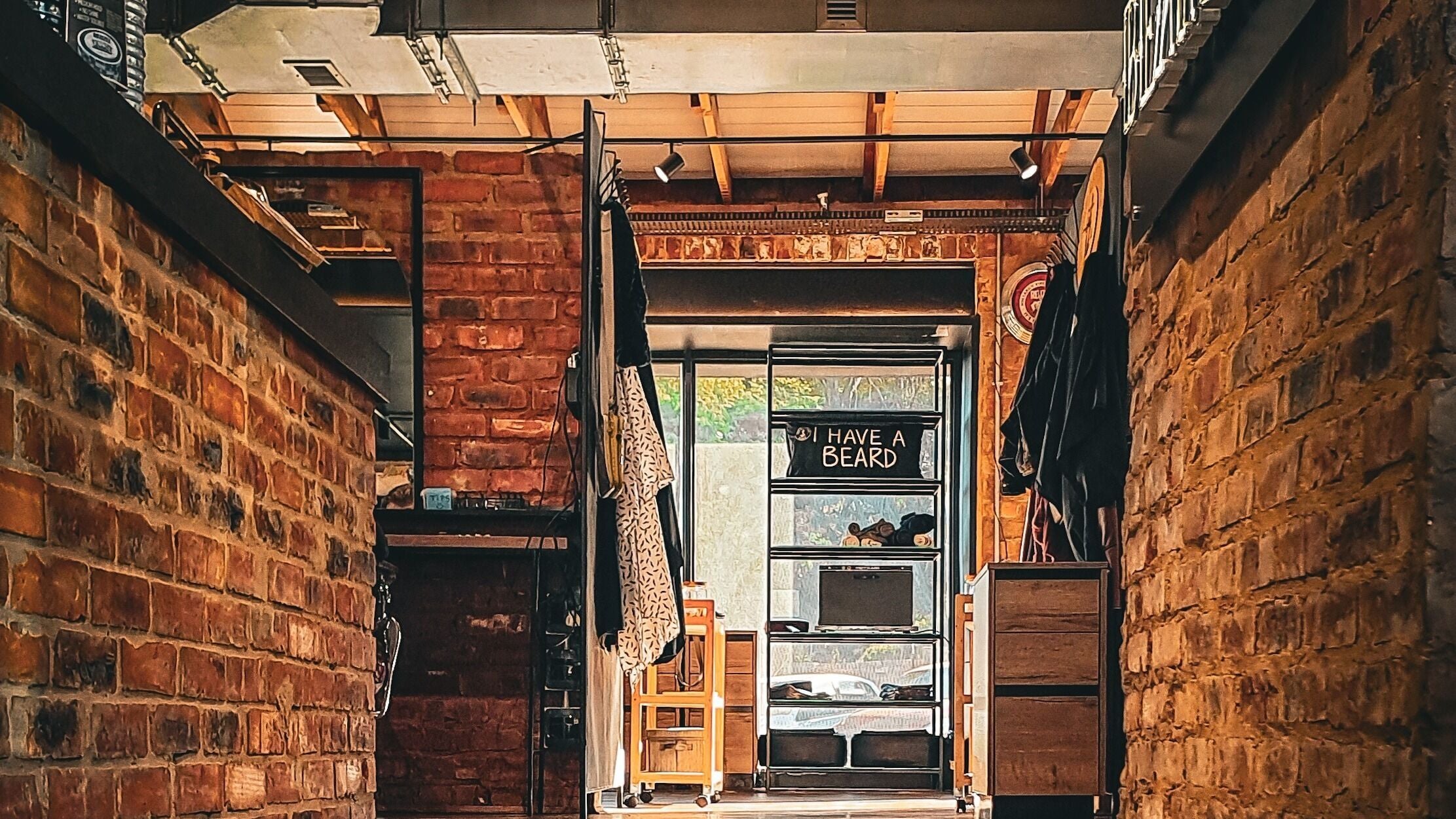 Interior view of Bab Barbers showcasing rustic brick walls in Pretoria, Gauteng, ZA.