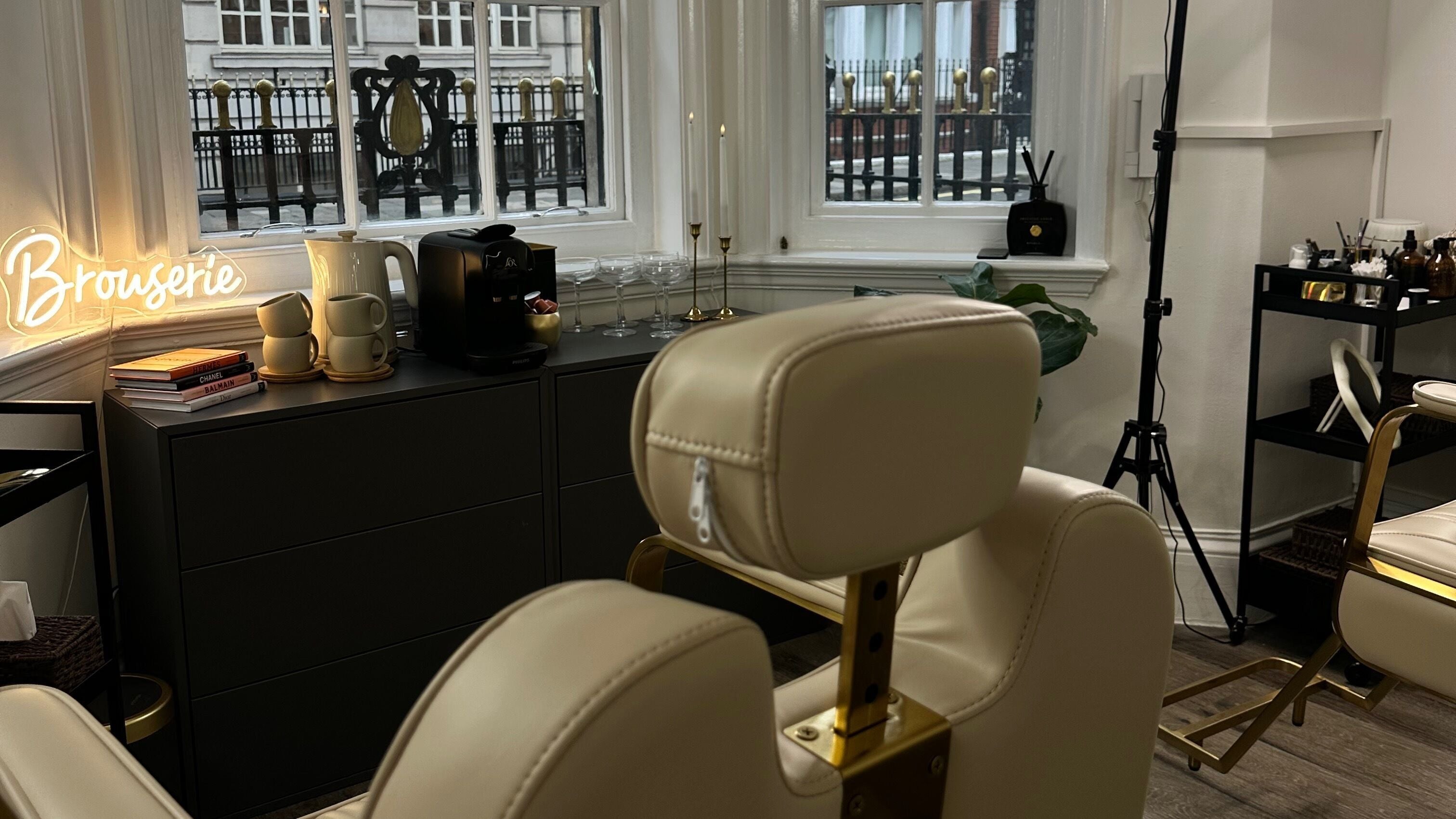 Elegant interior of Browserie London with cream chairs and decor in London, England, GB.