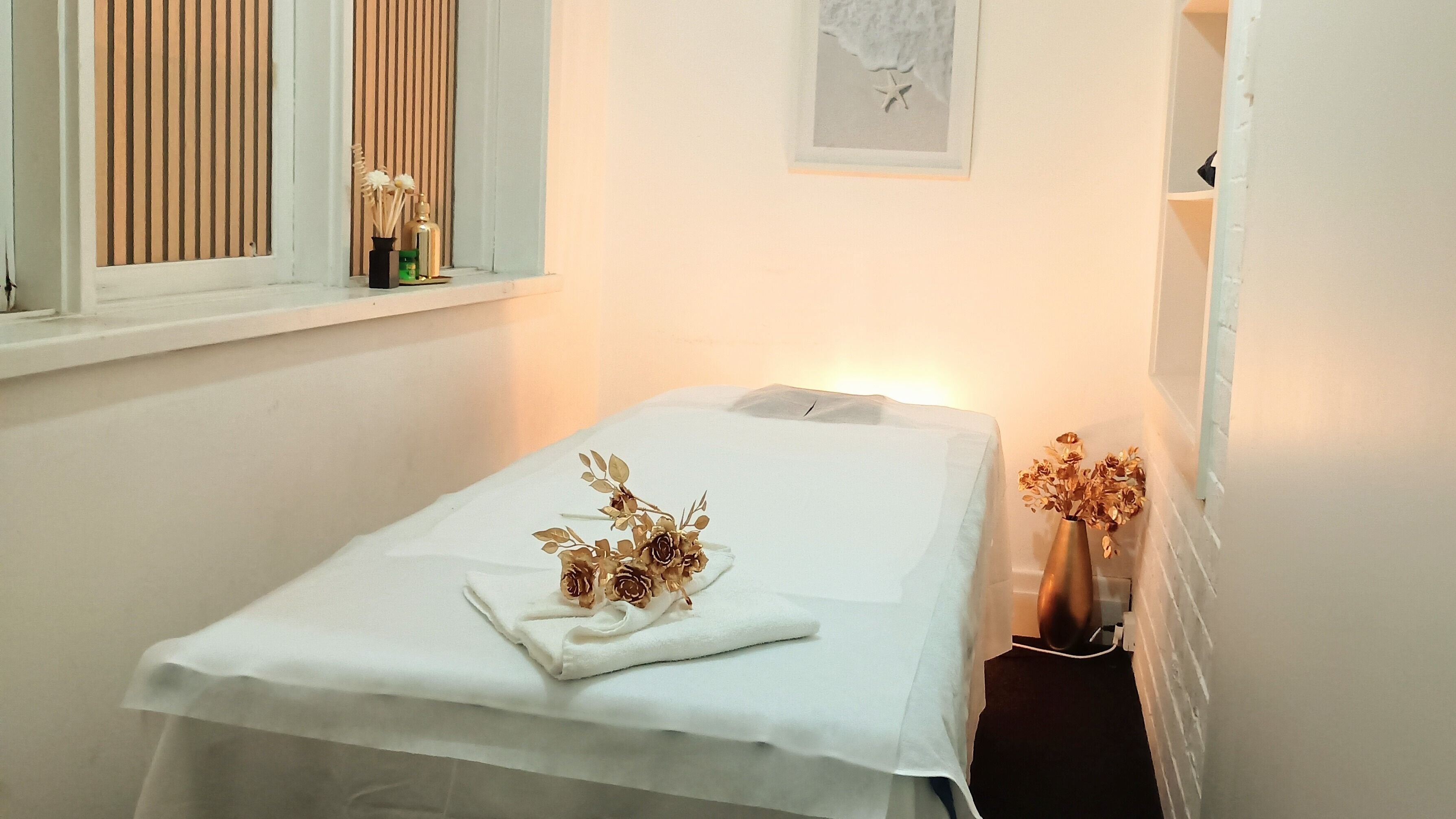 Tranquil massage room at A Plus Thai Massage & Spa, Melbourne, Victoria, AU, featuring a cozy table and elegant decor.