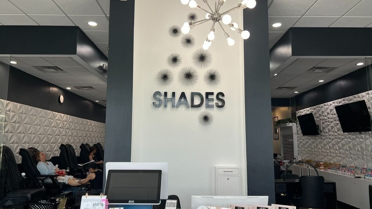Interior of Shades Nail Bar in Worthington, Ohio, US showcasing chic decor and serene atmosphere.