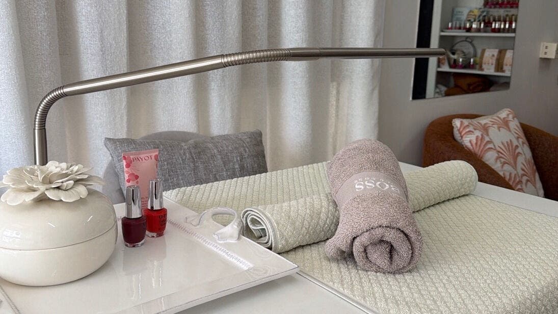 Luxurious spa setup at Hoi Polloi Beauty Center Mooloolaba, Mooloolaba, Queensland, AU with towels and nail polish.