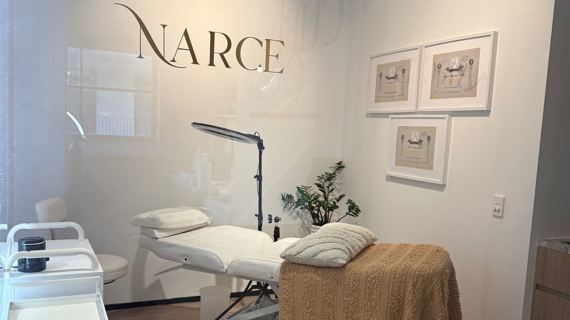 Relaxing treatment room at Narce, West End, Queensland, AU, with a comfortable bed and calming decor.
