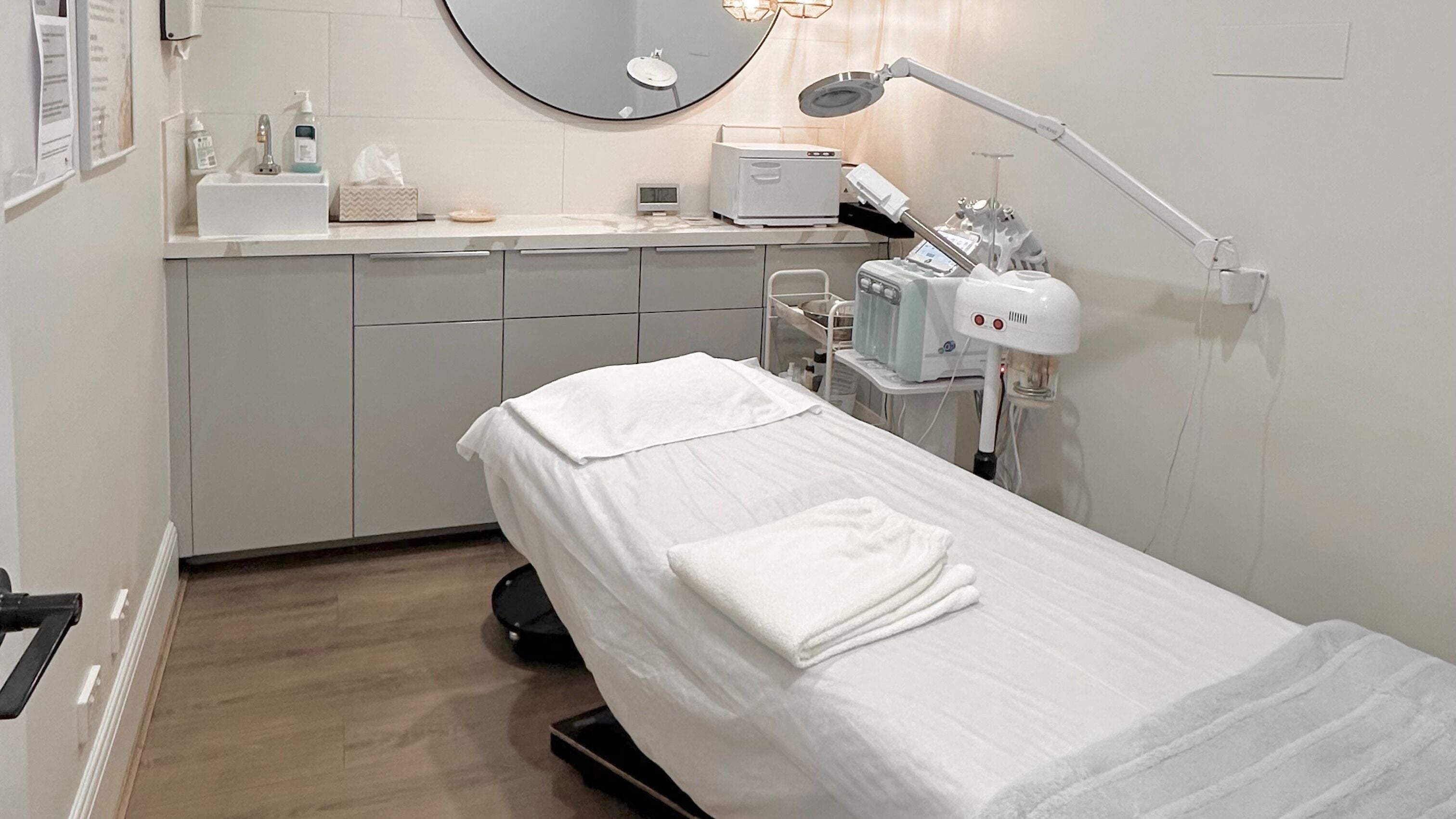 Modern treatment room at Lavina Beauty in Hampton, Victoria, AU, featuring a comfortable spa bed and elegant decor.