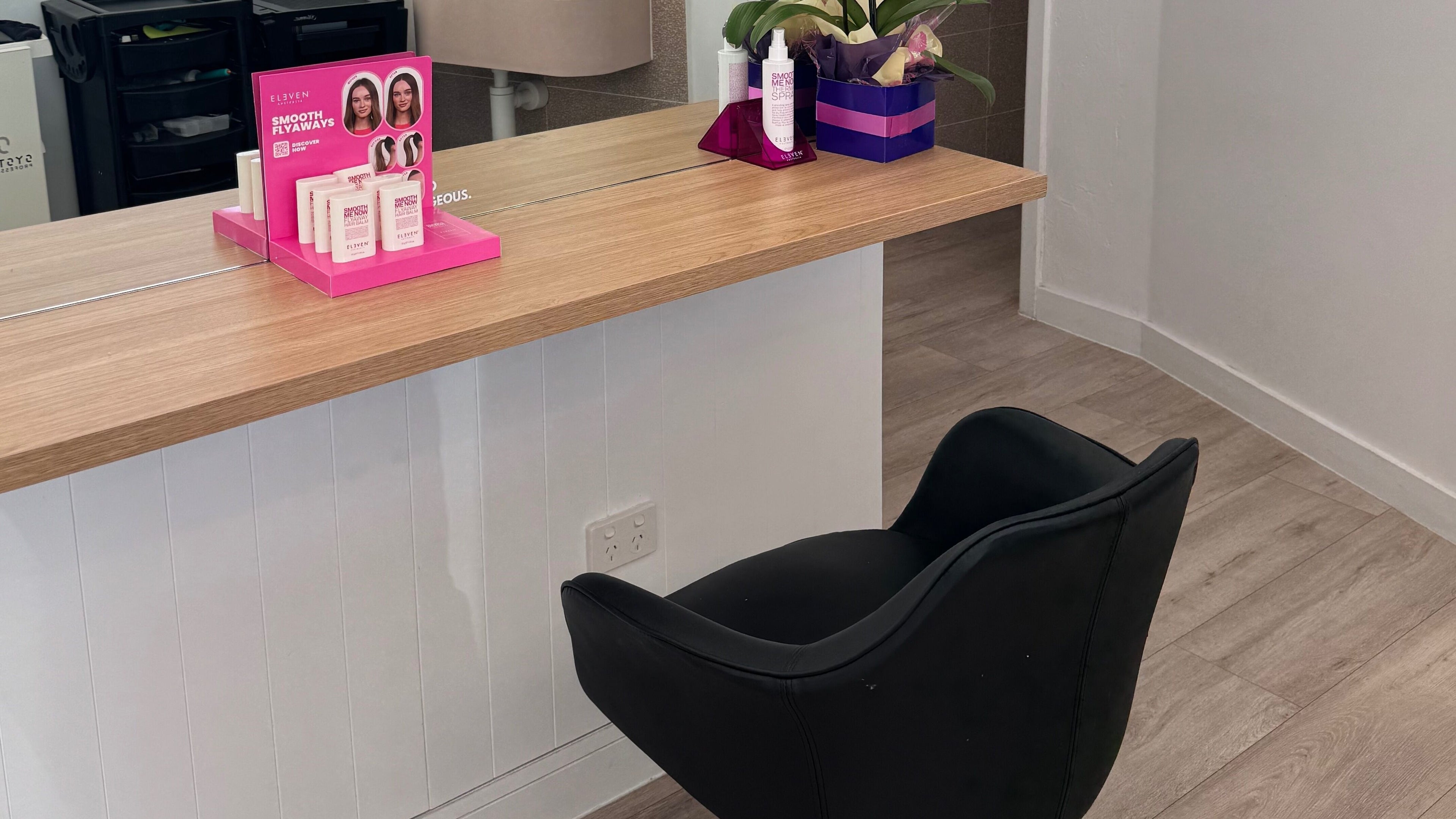 Styling chair and product display at Hair By Simone, Melbourne, Victoria, AU. Elegant salon ambiance captured.