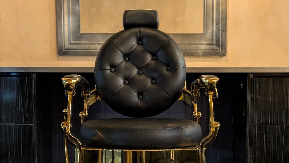 Luxurious barber chair at Kalon Amara Barbers in West End, QLD, AU, showcasing comfort and style.