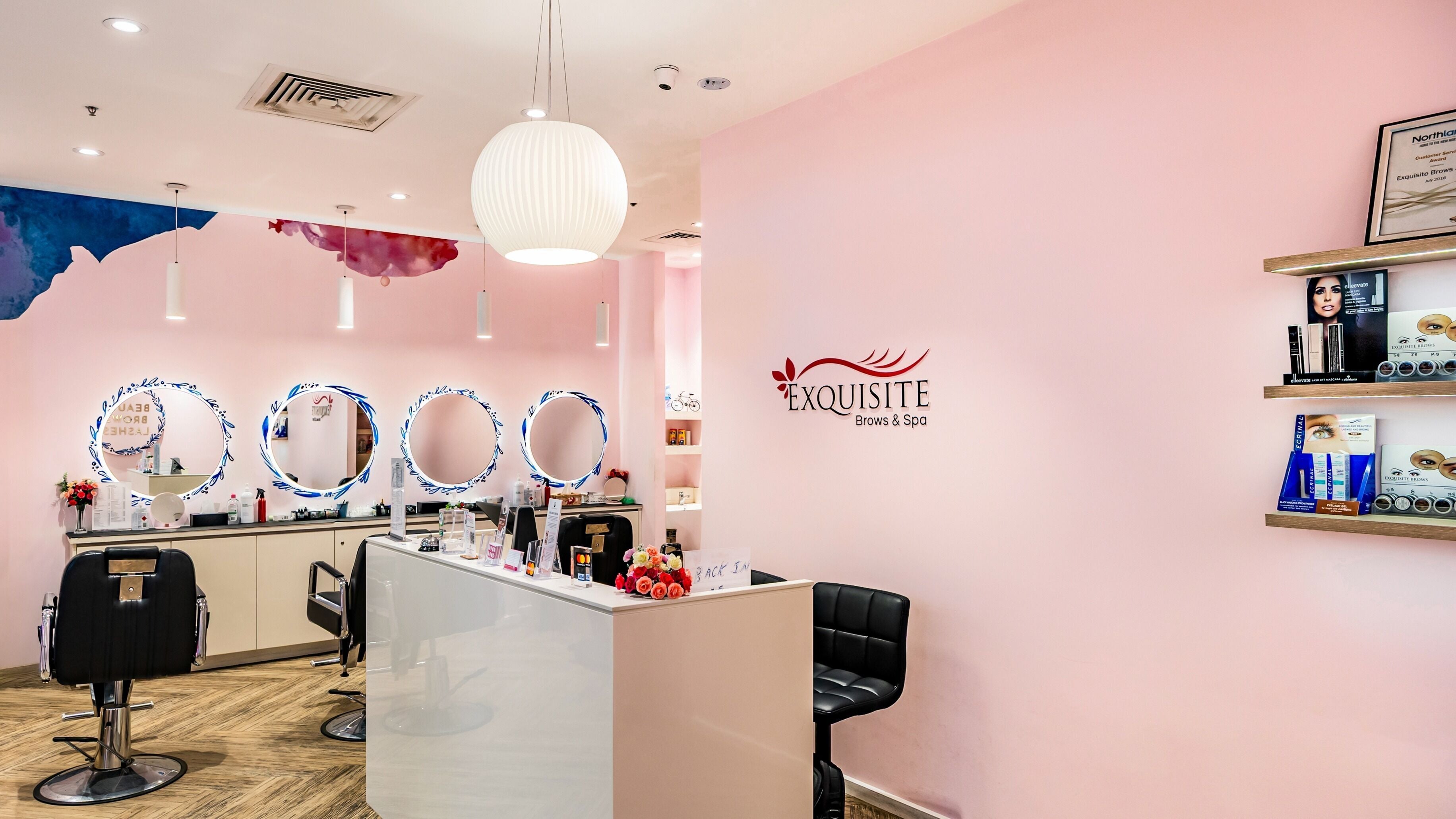 Elegant interior of Exquisite Brows and Spa Northland, Melbourne, Victoria, AU with modern decor and beauty displays.