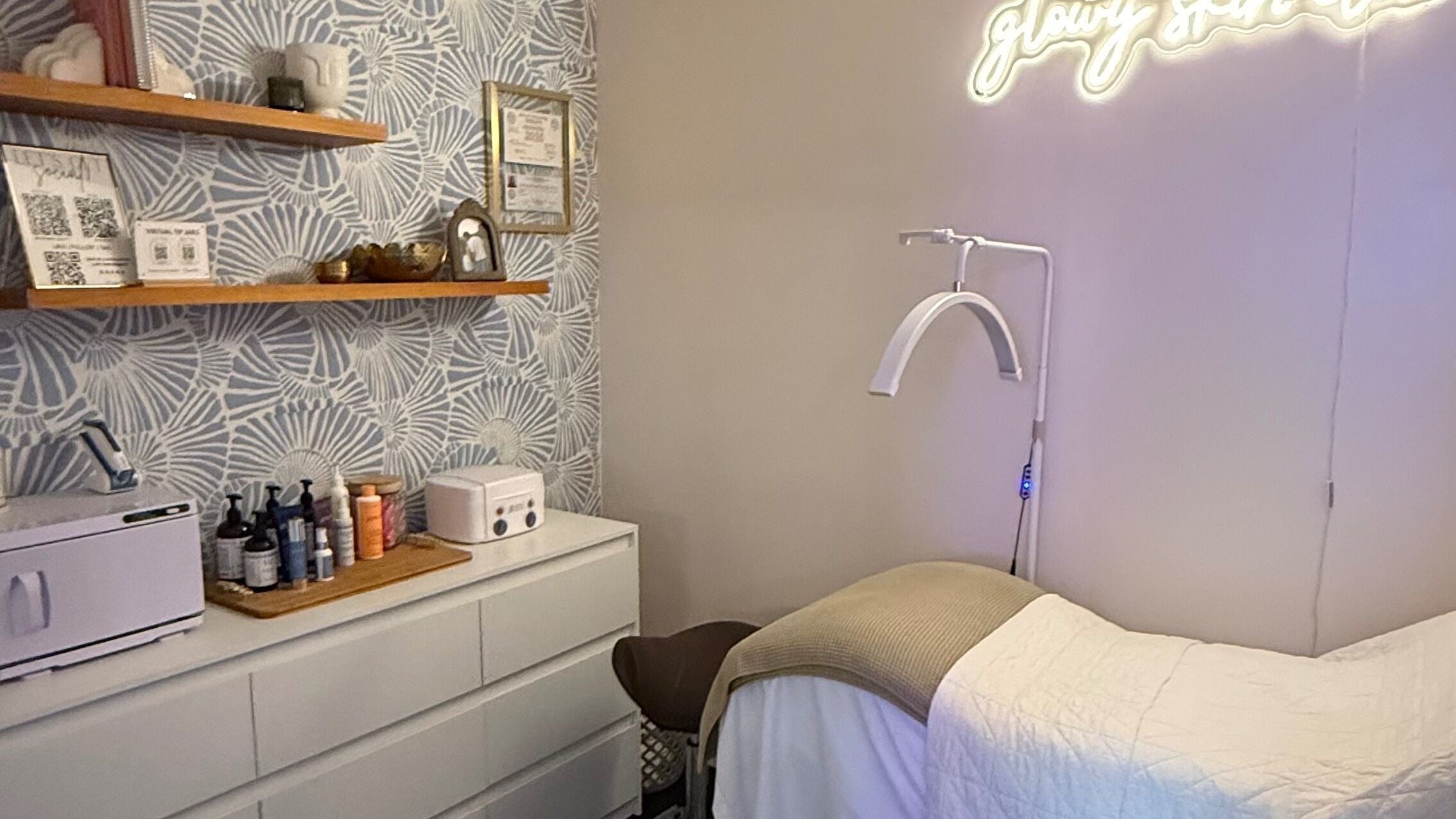 Relaxing treatment room at The Daily Glow LLC, Tuscaloosa, Alabama, US, with elegant decor and ambient lighting.