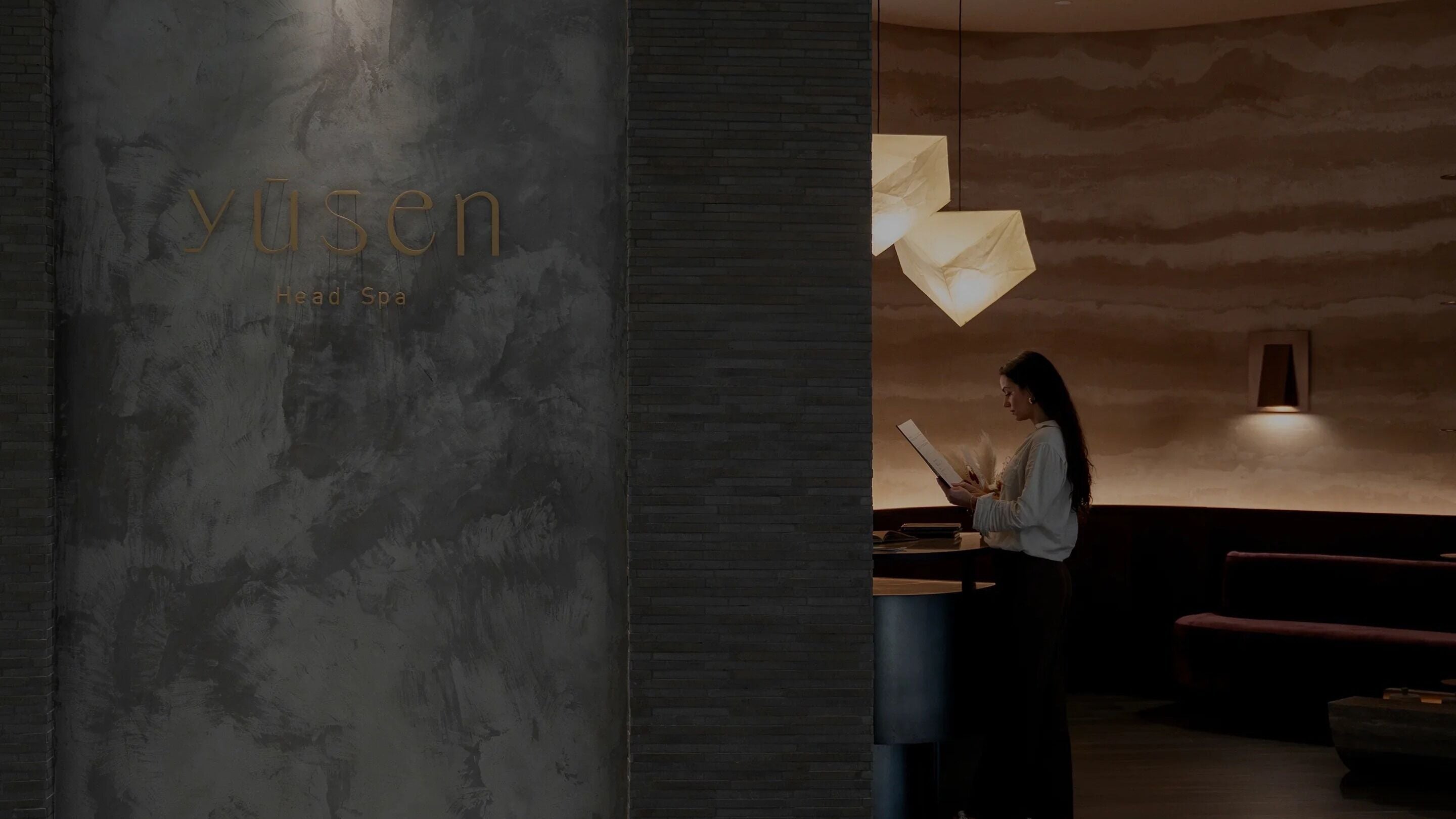 Entrance view of Yusen Headspa in Broadbeach Waters, Queensland, AU, featuring modern decor and soft lighting.