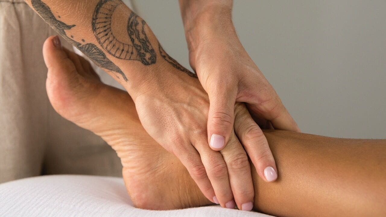 Therapist performing a relaxing foot massage at Lymph by Camila, Lisboa, Lisboa, PT.