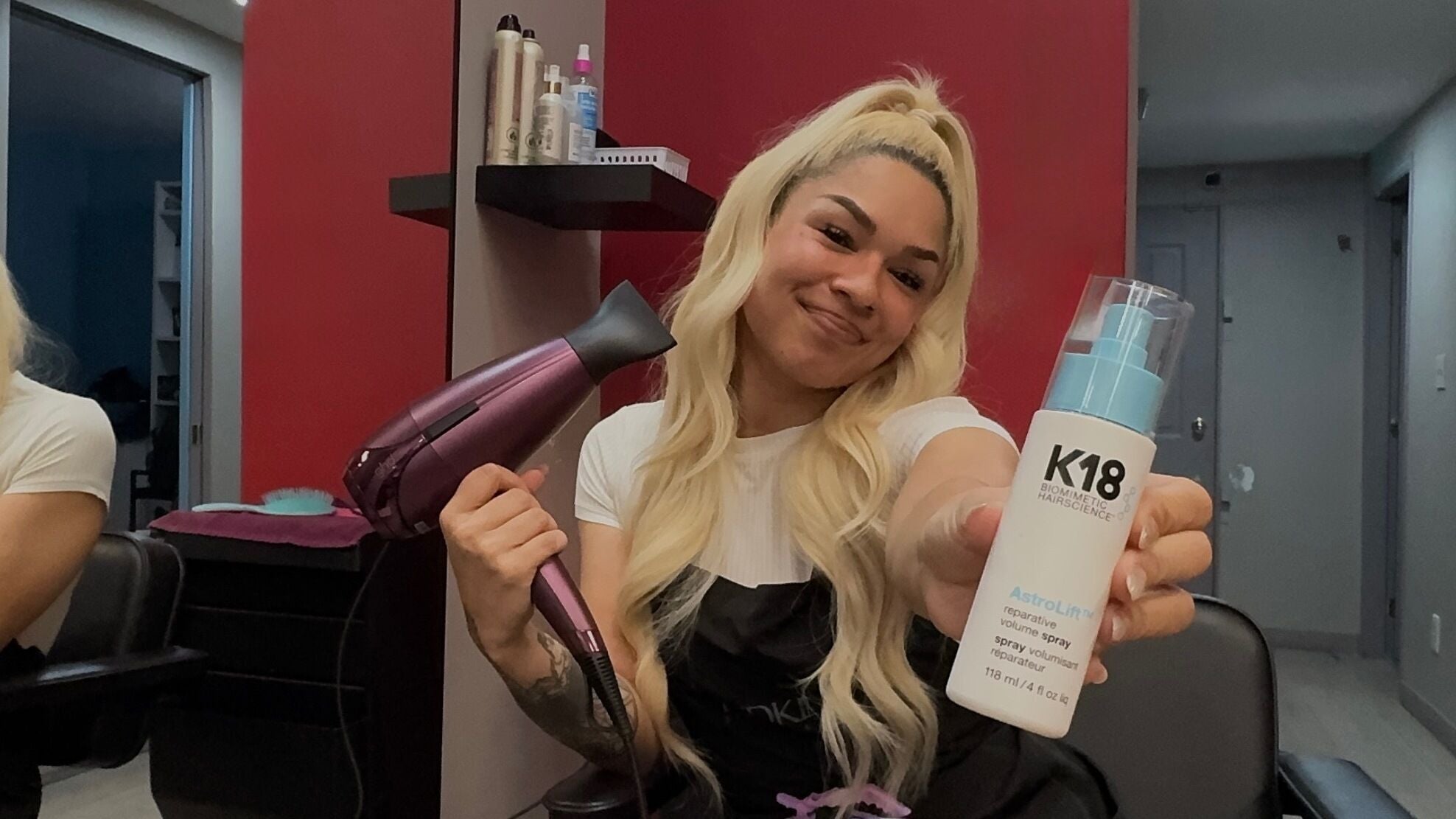 Stylist at Keeks Hair Studio in Burnaby, British Columbia, CA, showcasing hair products and tools.
