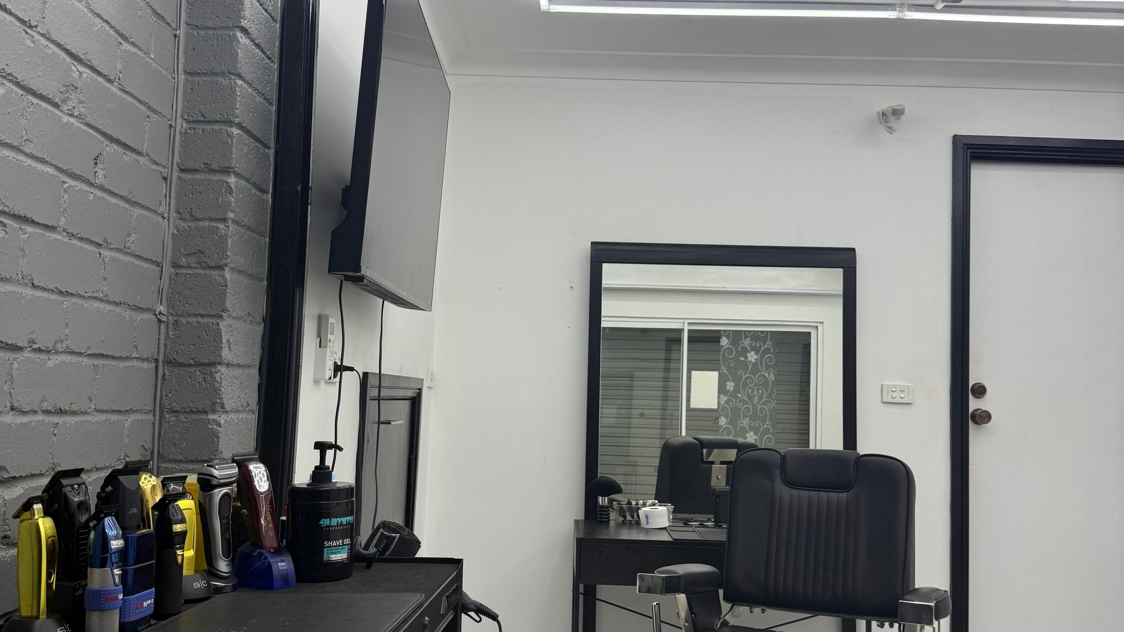 Modern salon setup at Novell Kuts, featuring styling tools and mirror, located in Edensor Park, New South Wales, AU.