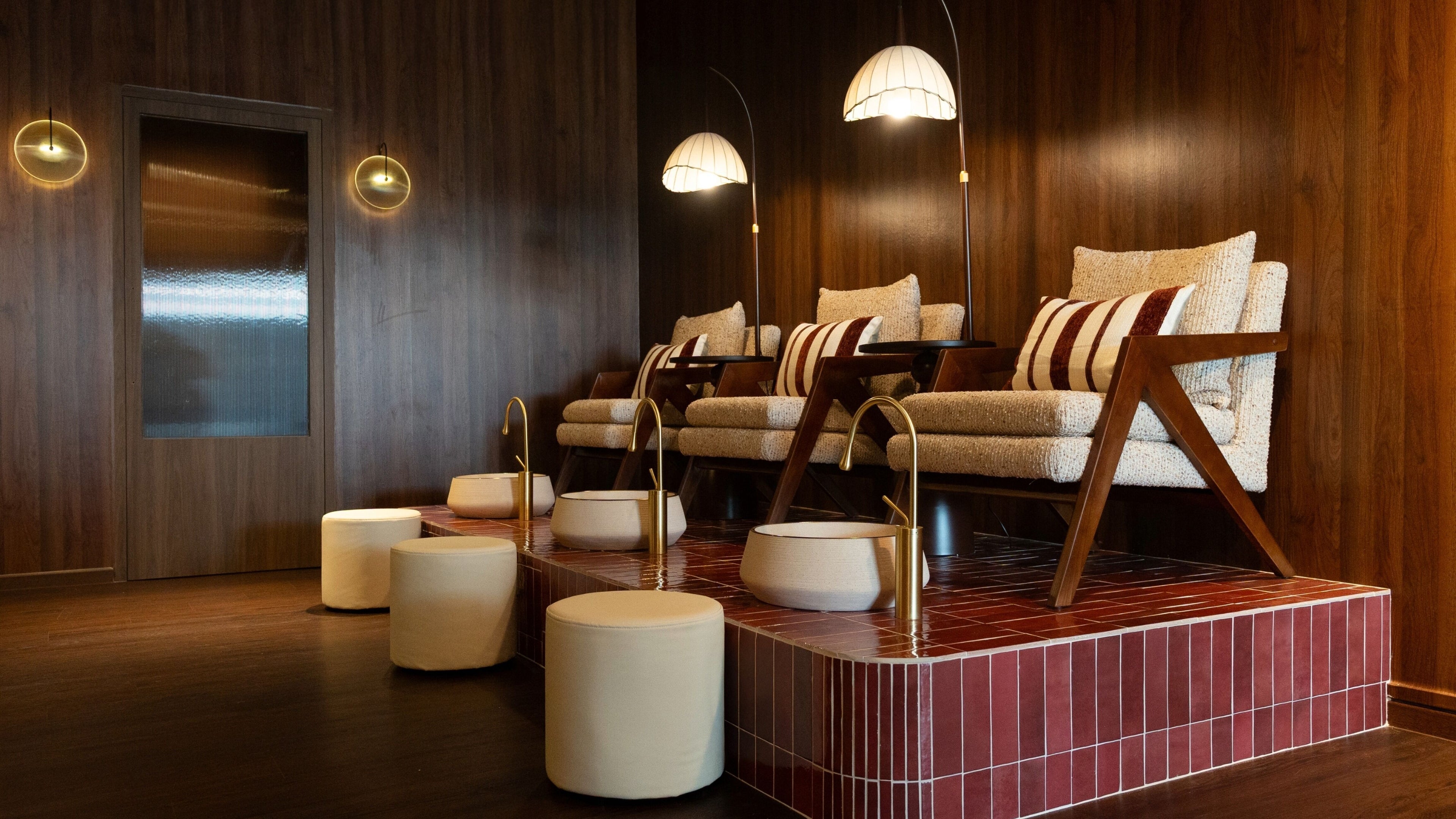 Luxurious seating at Cupid's Club, Singapore, SG with plush chairs and warm lighting.