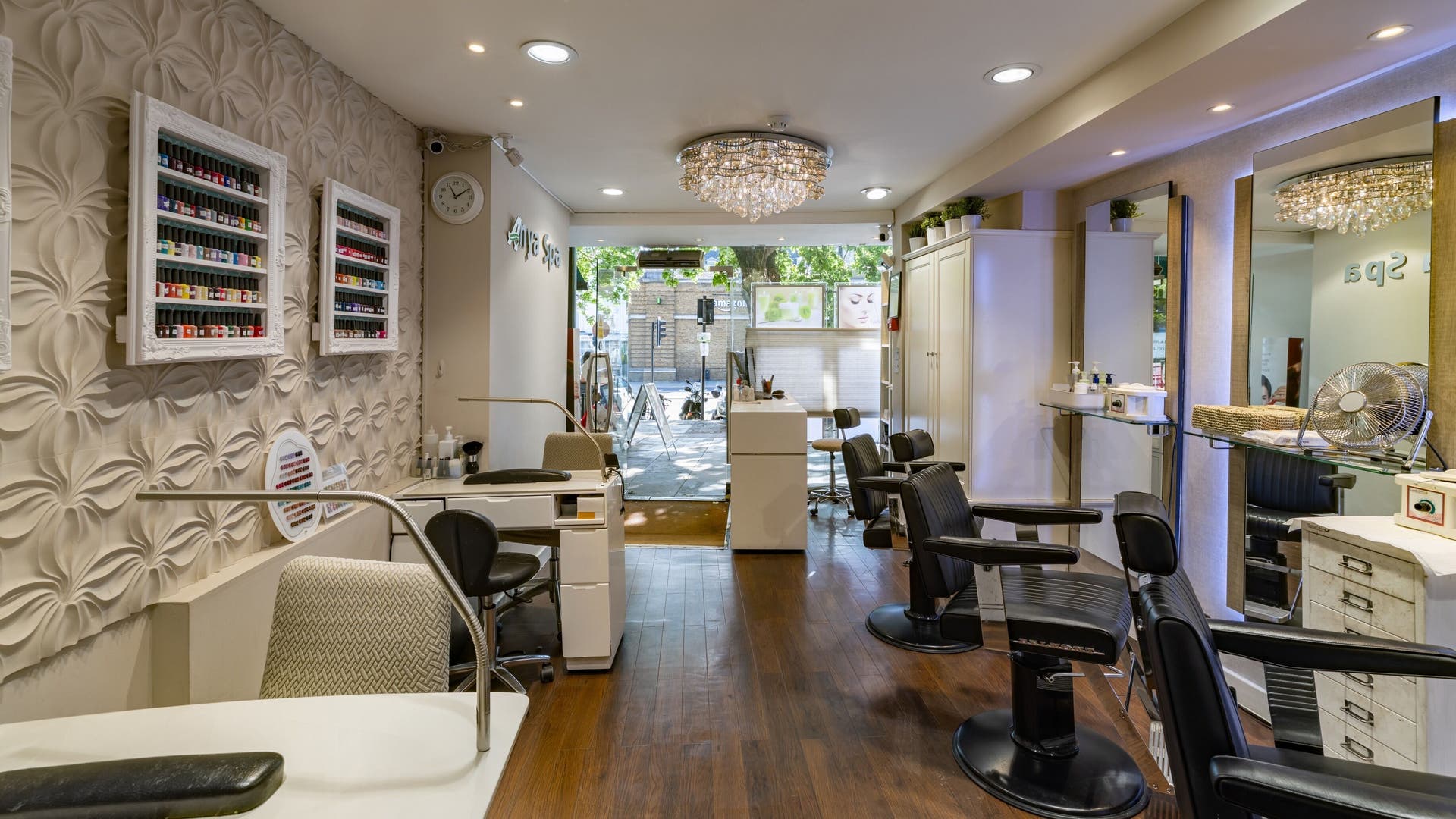 Interior of Anya Spa@Angel in London, England, GB with stylish decor and nail polish display.