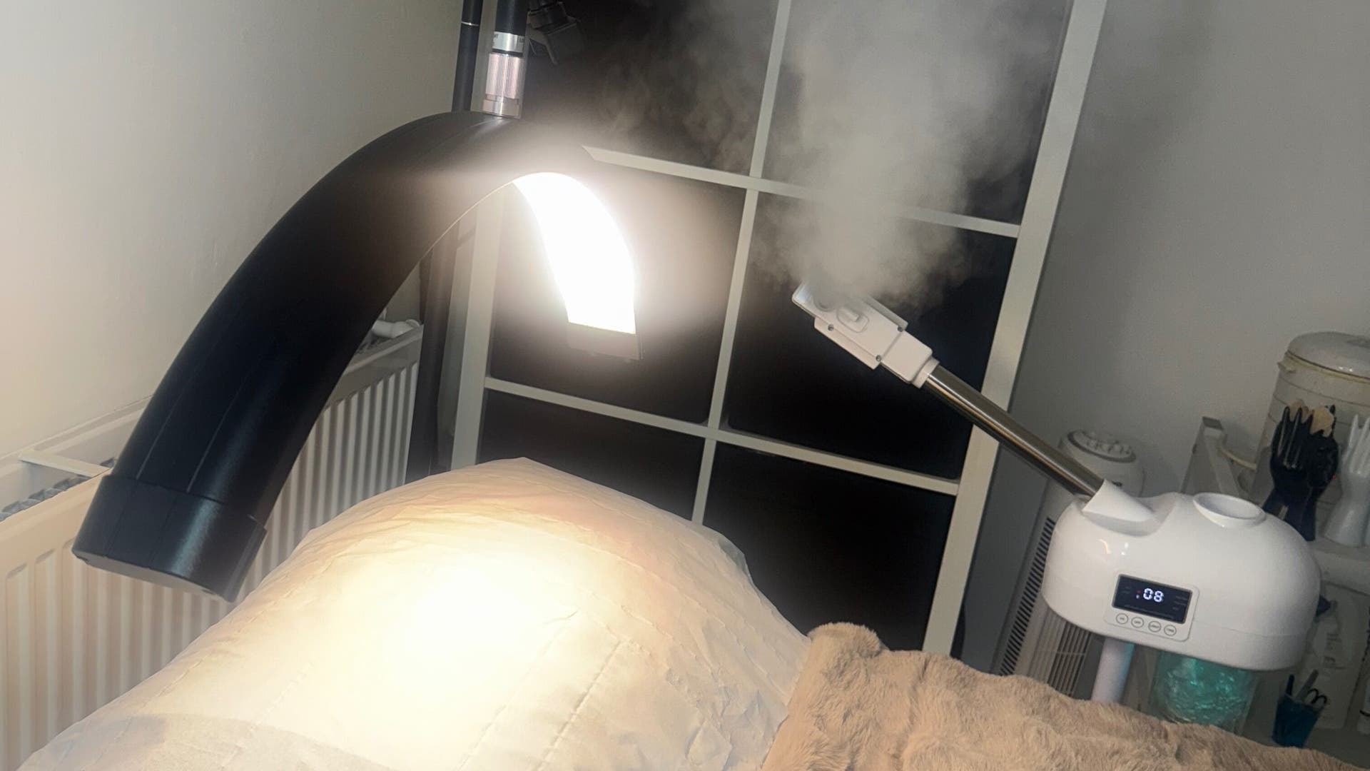 Facial treatment setup at Maia Cosmetics, London, England, GB, showcasing a modern facial steamer.