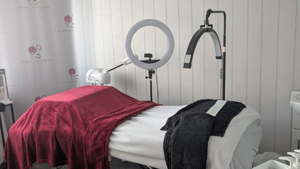 Treatment room at Radiant Reflection in Coventry, England, GB, featuring a massage table with luxury linens.