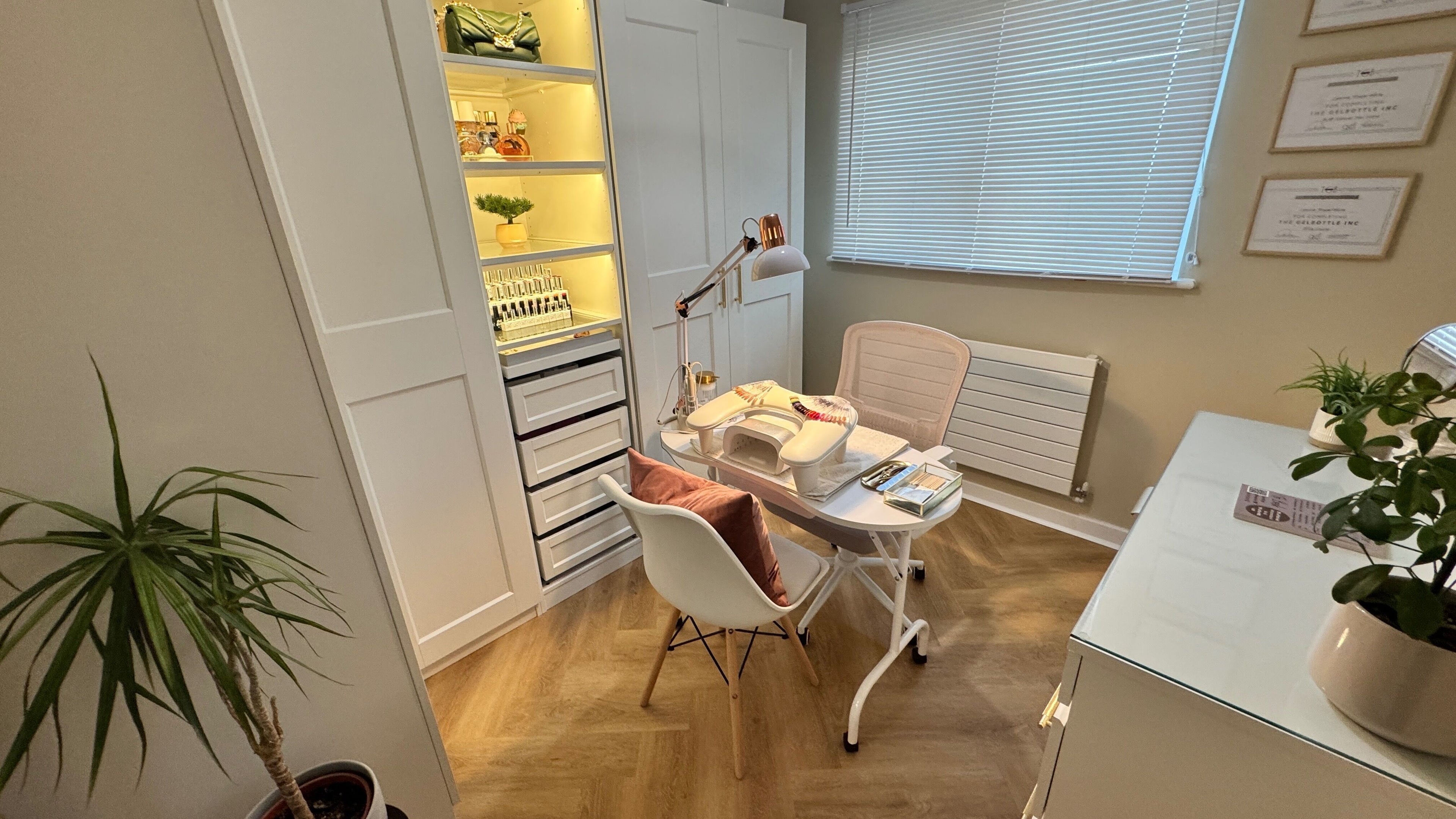 Elegant nail studio at Nova Noir Nails in Peacehaven, England. Cozy ambiance with modern decor and nail polish display.