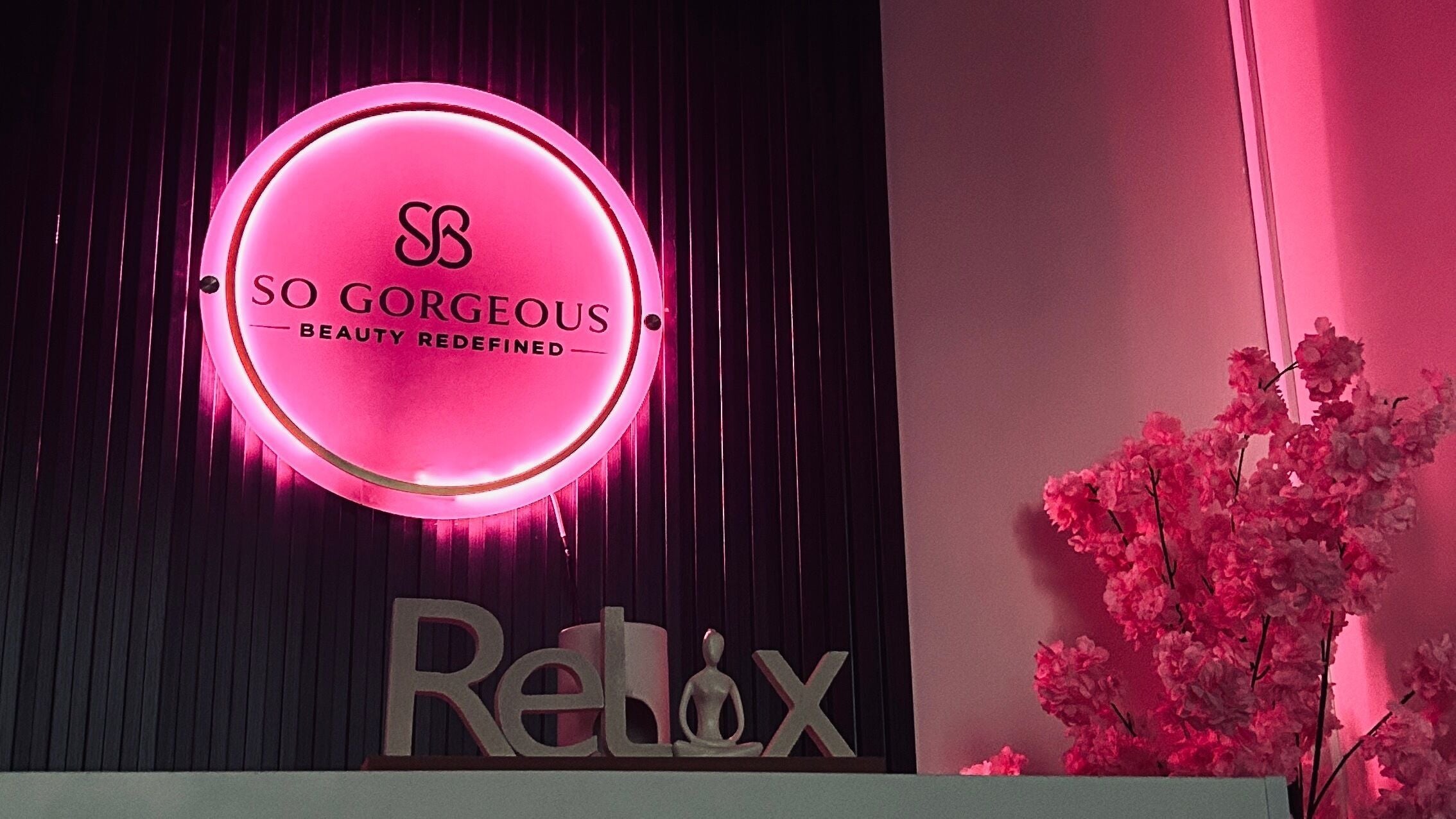 So Gorgeous sign with pink glow and flowers, located in Midrand, Gauteng, ZA, exuding elegance and tranquility.