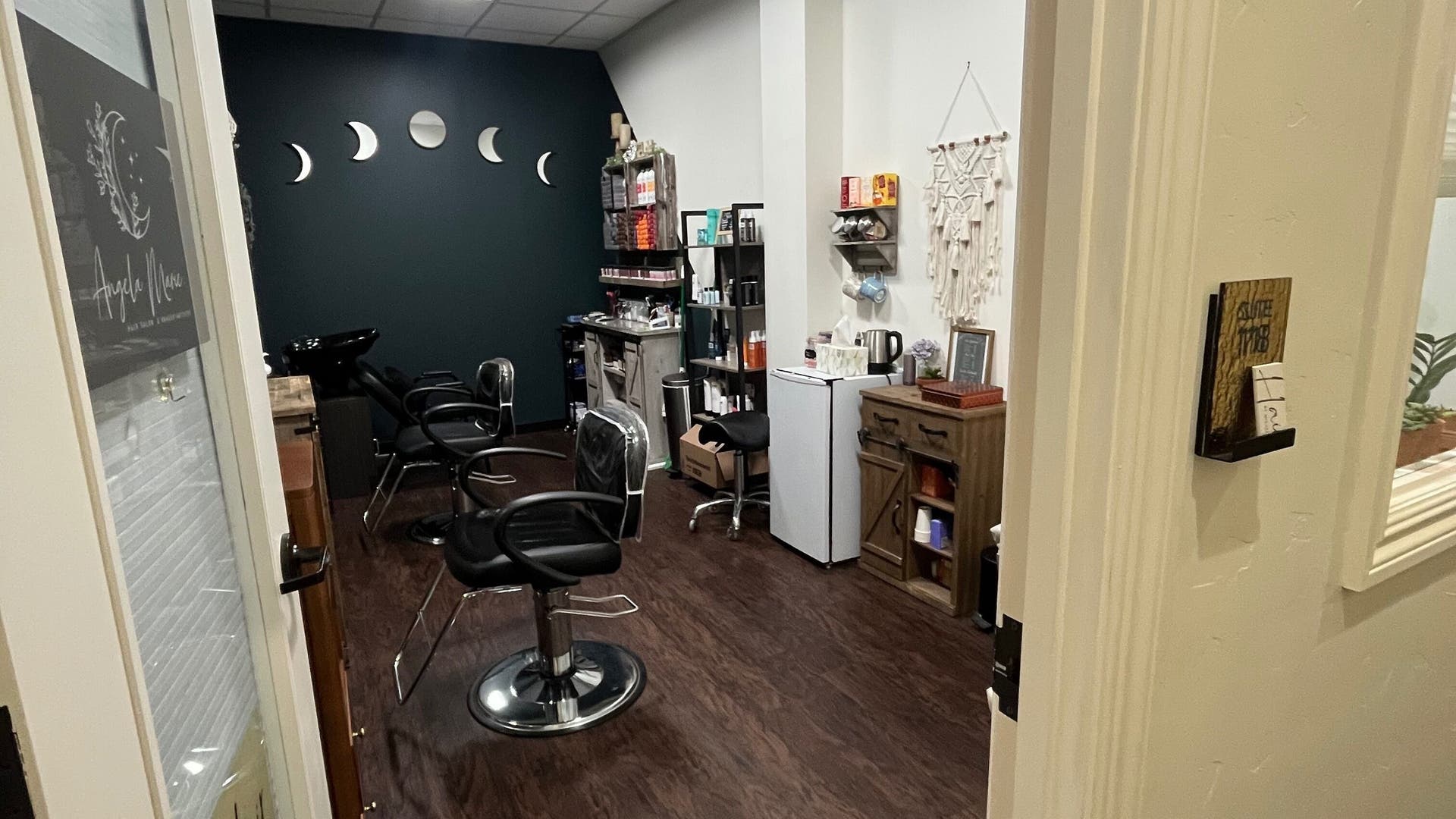 Modern salon interior at Hair by Micaela Rae, East Meadow, New York, US, featuring stylish chairs and decor.