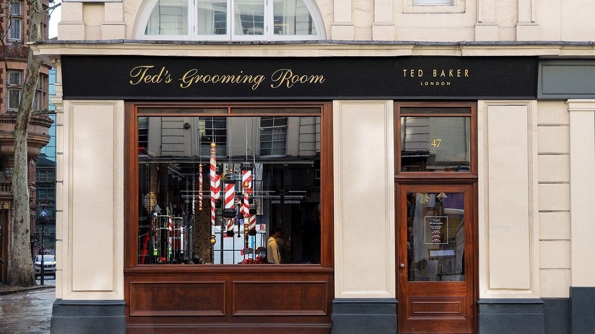 Exterior of Bloomsbury - New Oxford Street, Ted's Grooming Room in London, England, GB with elegant signage.