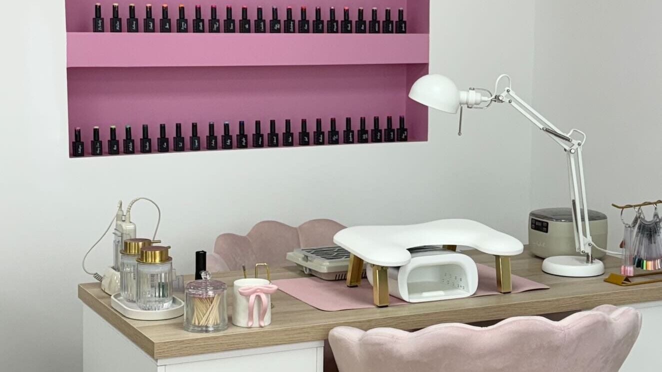 Stylish nail station at Anna Rae Beauty, Paisley, Scotland, GB, showcasing manicure tools and polish display.