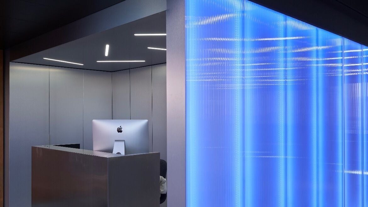 Sleek reception desk with blue lighting at Matheos Carvalho, Lisboa, Lisboa, PT.