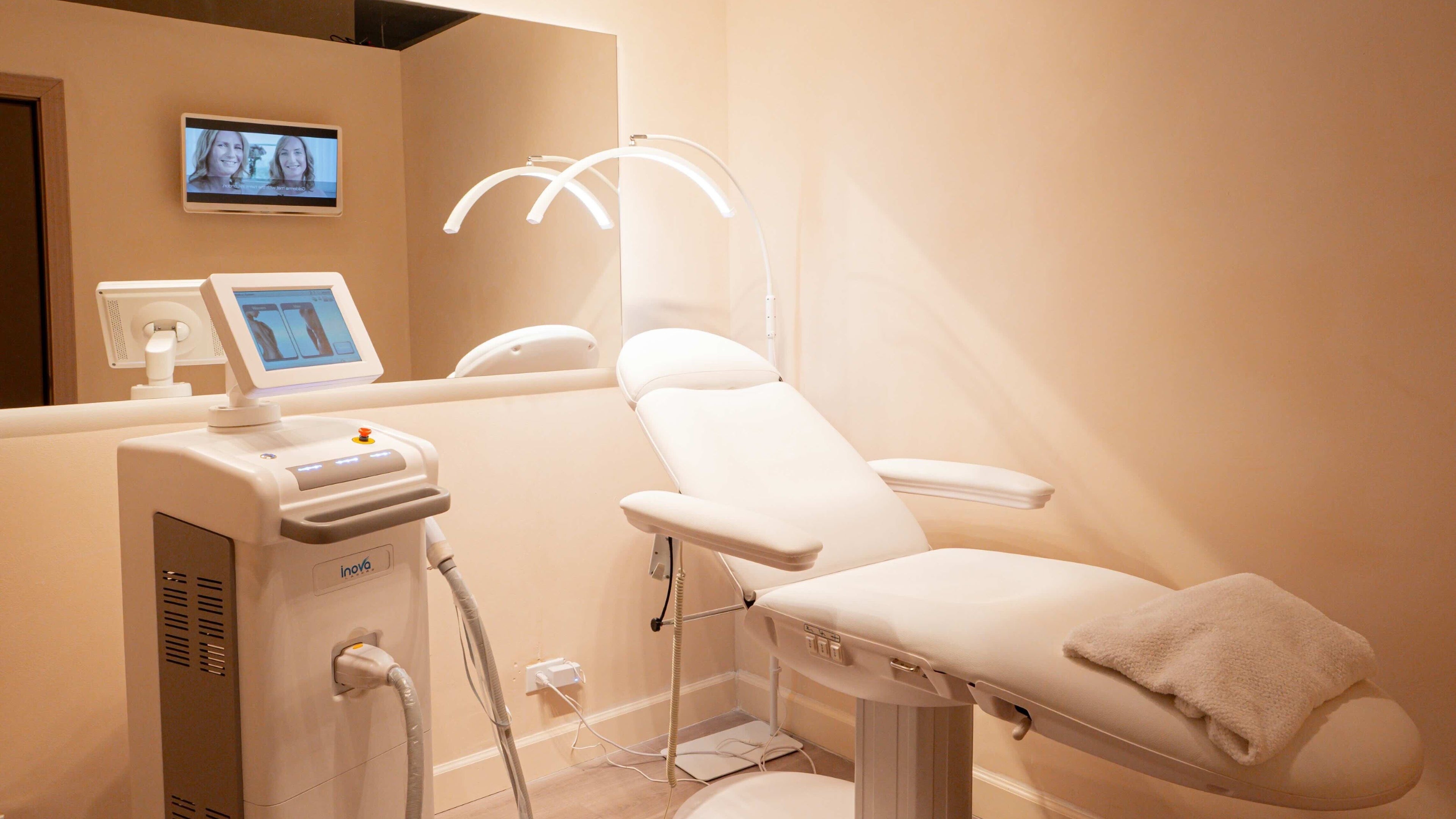 Spacious treatment room at Skin City Lab in New York, New York, US, featuring advanced beauty equipment.