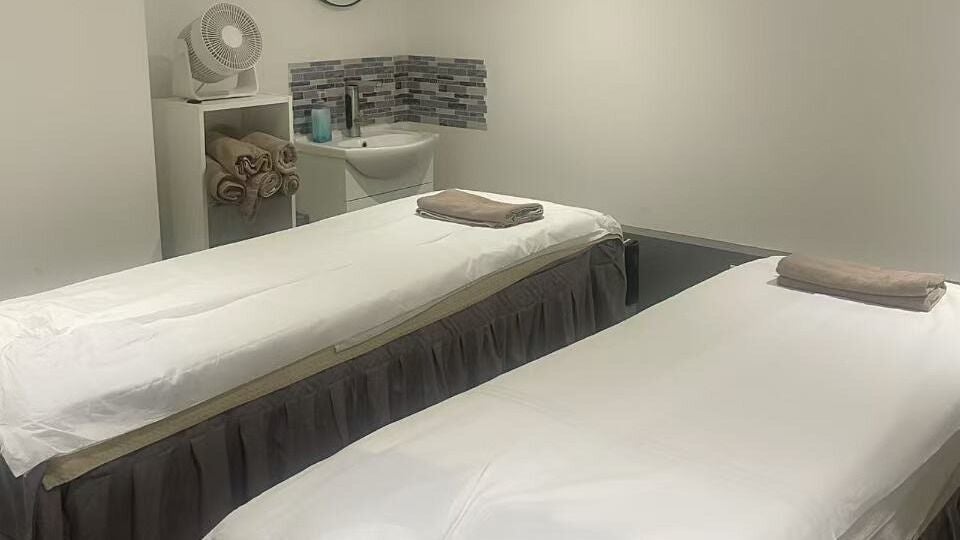 Relaxing treatment room with two beds at L&R SPA, London, England, GB, designed for ultimate tranquility.