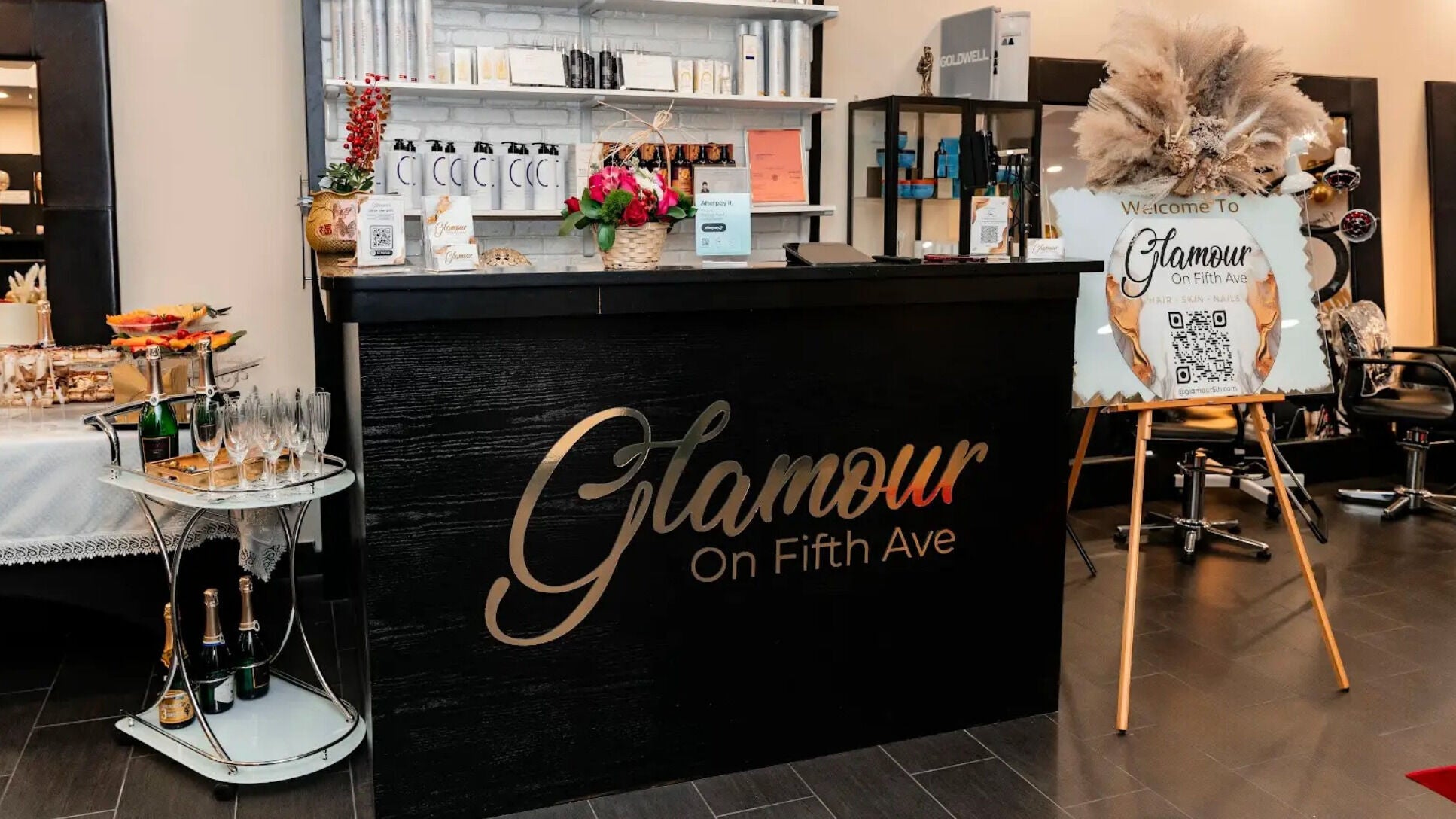 Luxurious reception area at Glamour on Fifth Ave, New York, New York, US, featuring elegant decor and refreshments.