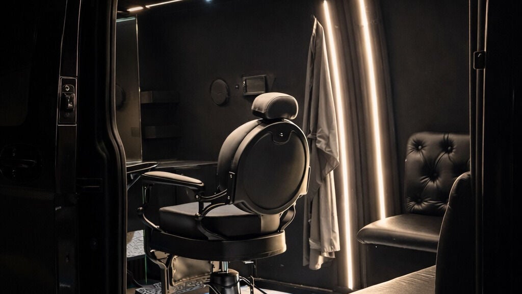 Fauteuil de barbier élégant à Barber Move, Genève, CH, dans une salle moderne et éclairée.