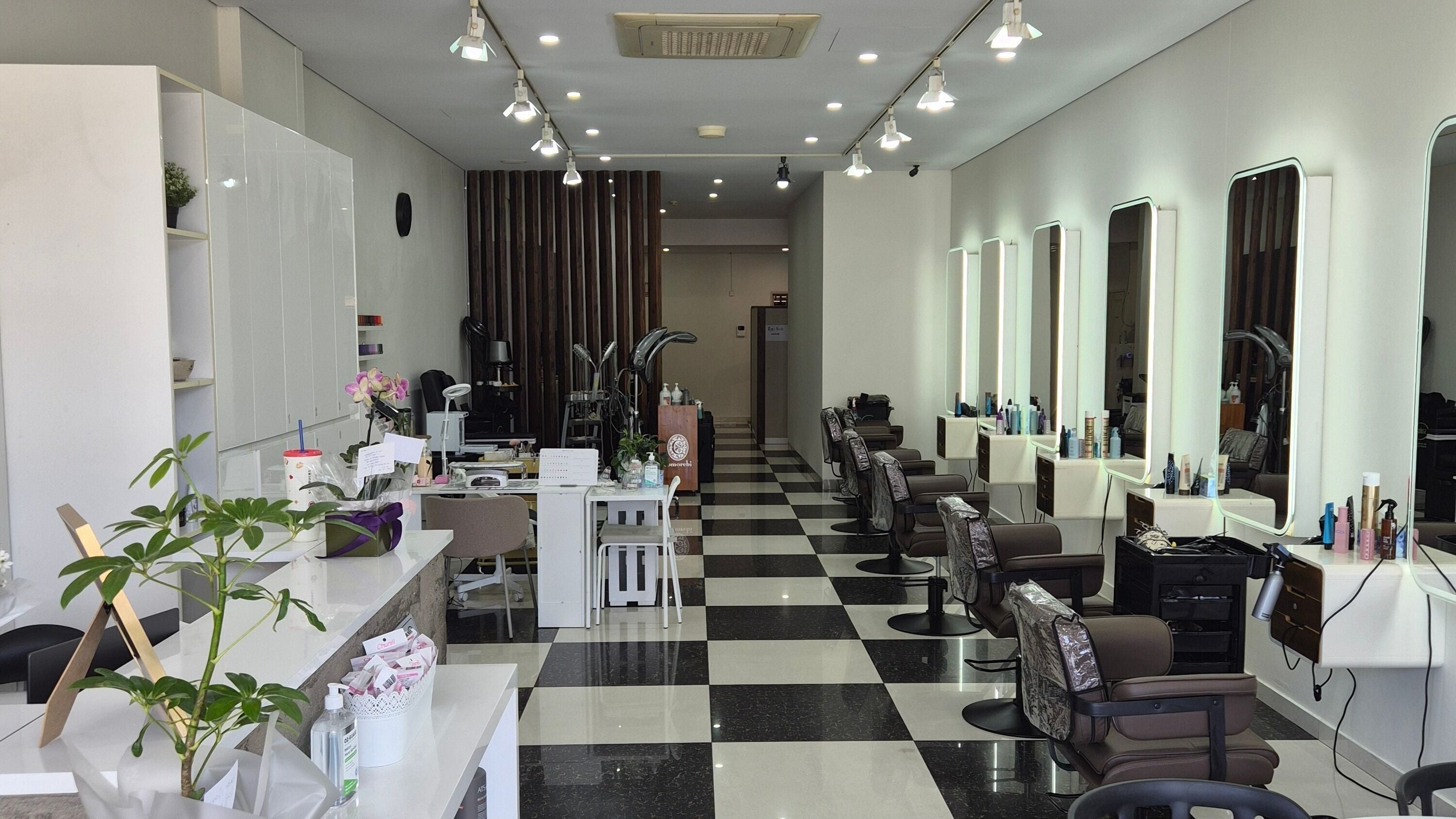 Bright, modern salon interior at Glow Hair Lab in Lidcombe, New South Wales, AU, featuring stylish stations.