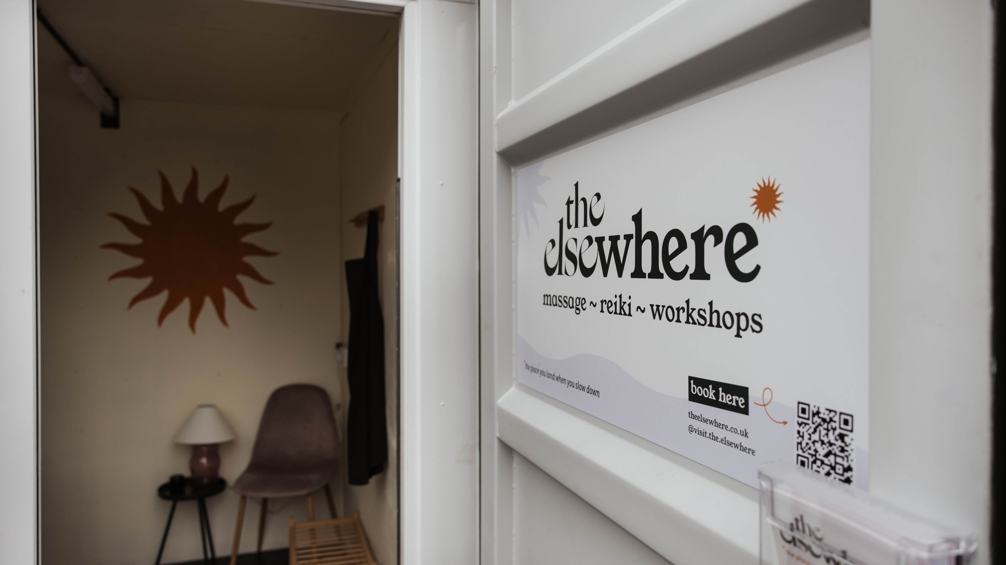 Entrance to The Elsewhere in Norwich, England, GB, showcasing a cozy interior space with a warm ambiance.