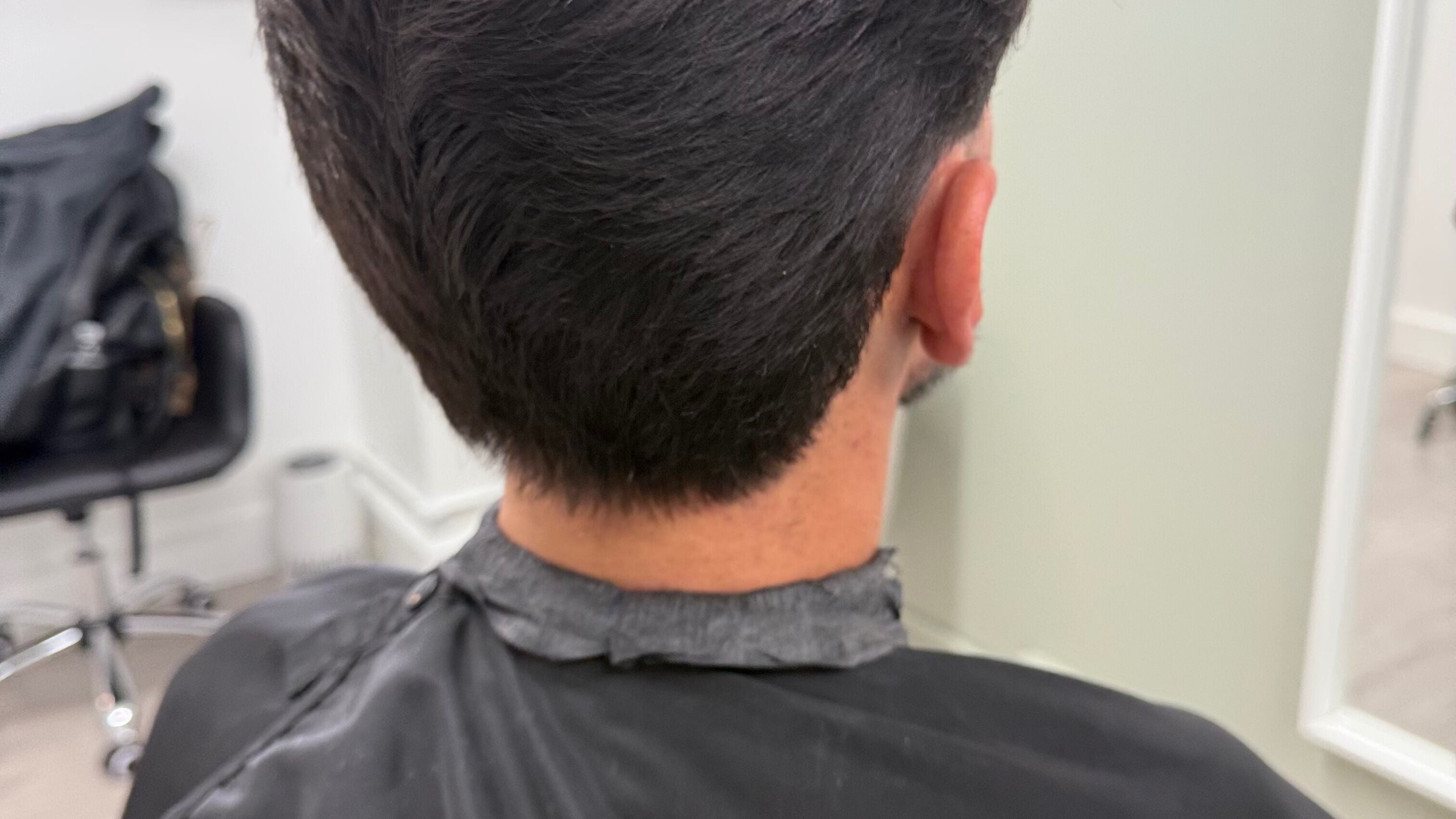Close-up of a stylish short haircut at AS Alex Santos Barber, New York, New York, US.
