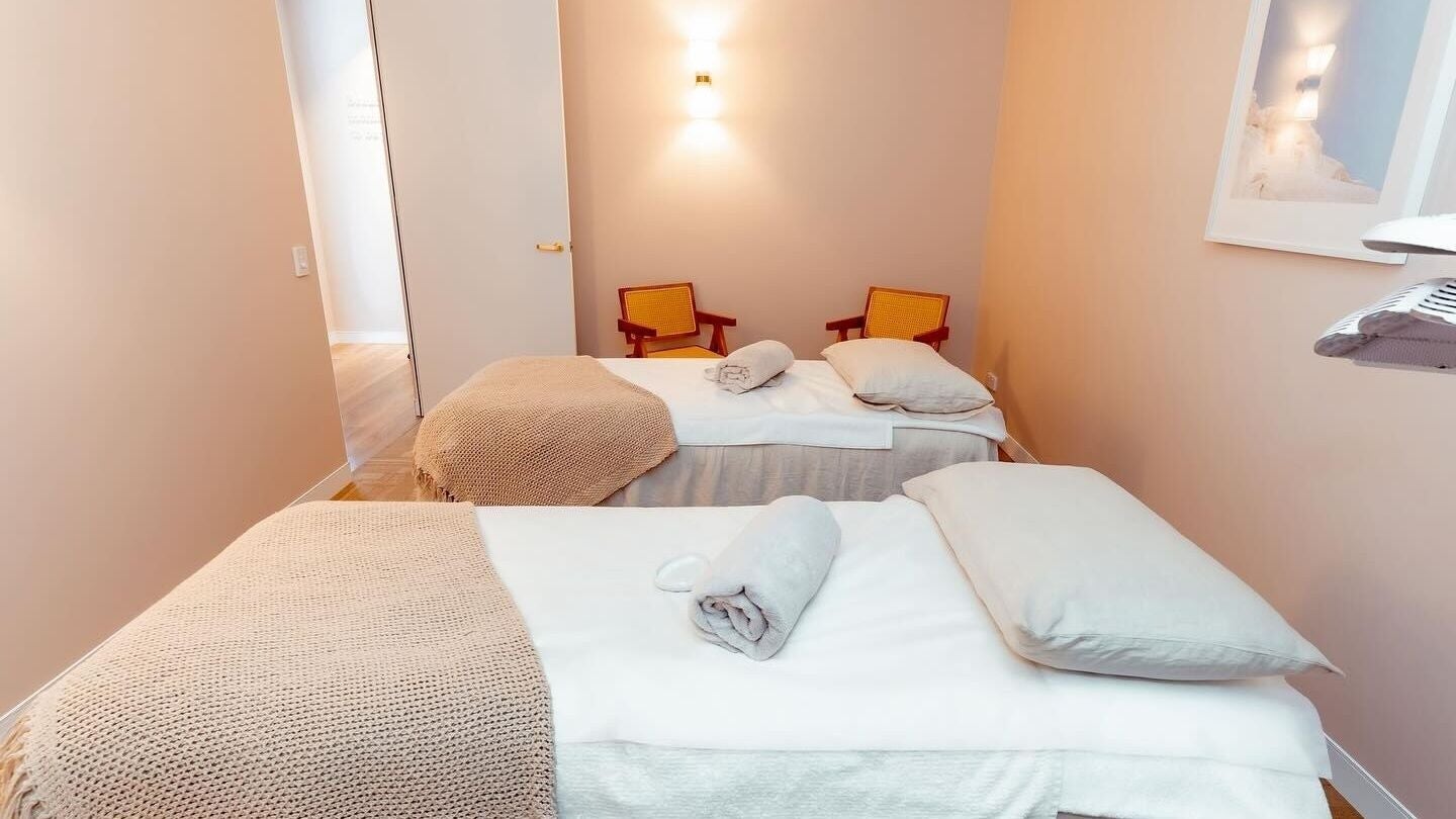 Cozy massage room with twin beds at Atma Wellbeing, Dee Why, New South Wales, AU, offering tranquil wellness experiences.