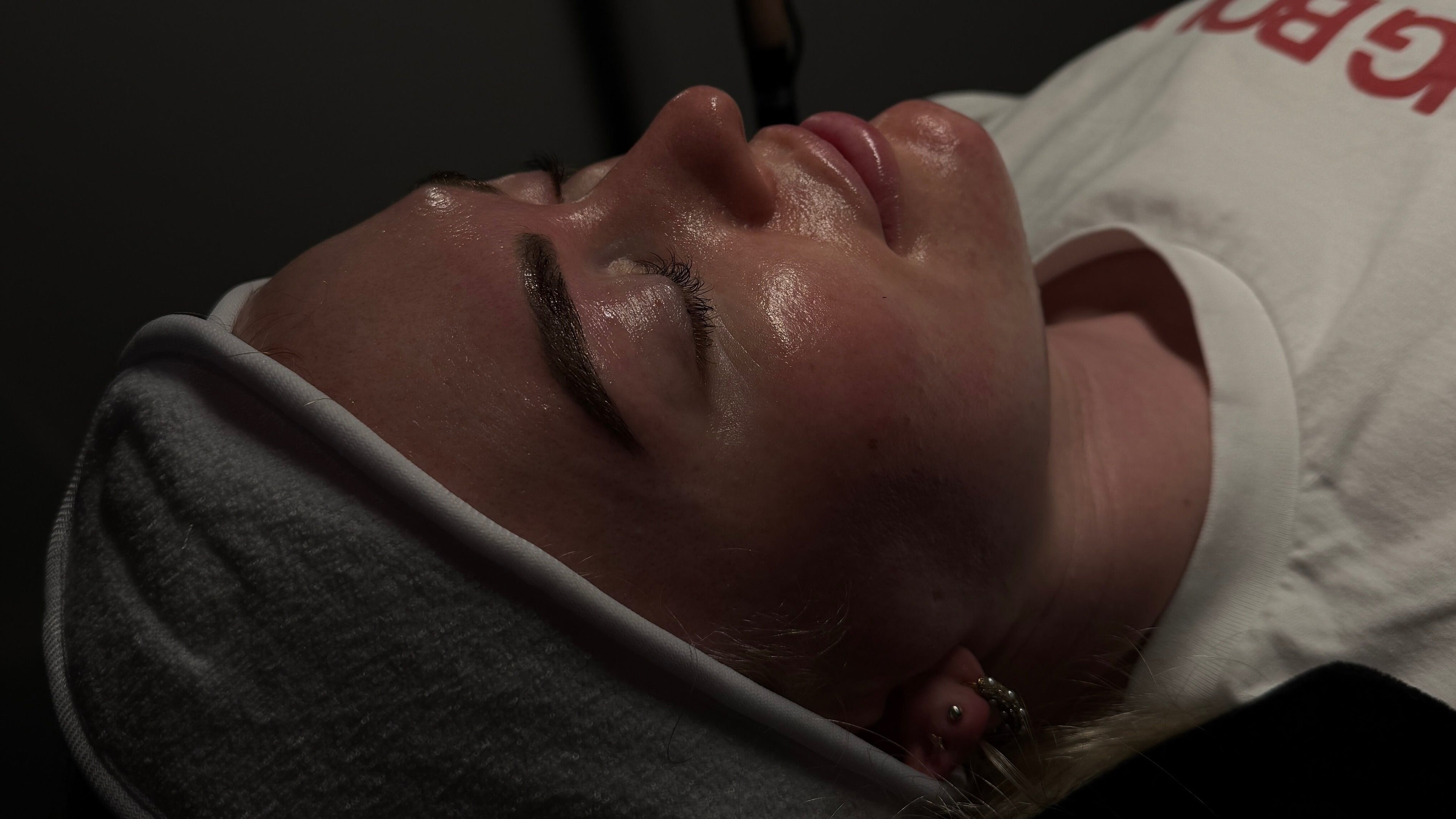 Relaxing facial treatment at Velour Studio, Northwich, England, GB, showcasing glowing skin results.