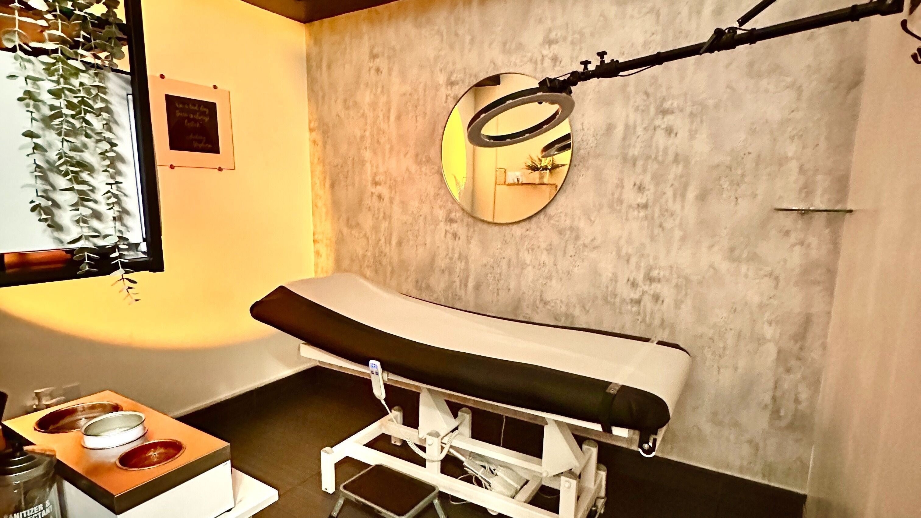 Elegant treatment room at Spa Bar, Orlando, Florida, US, featuring a comfortable massage bed and ambient lighting.