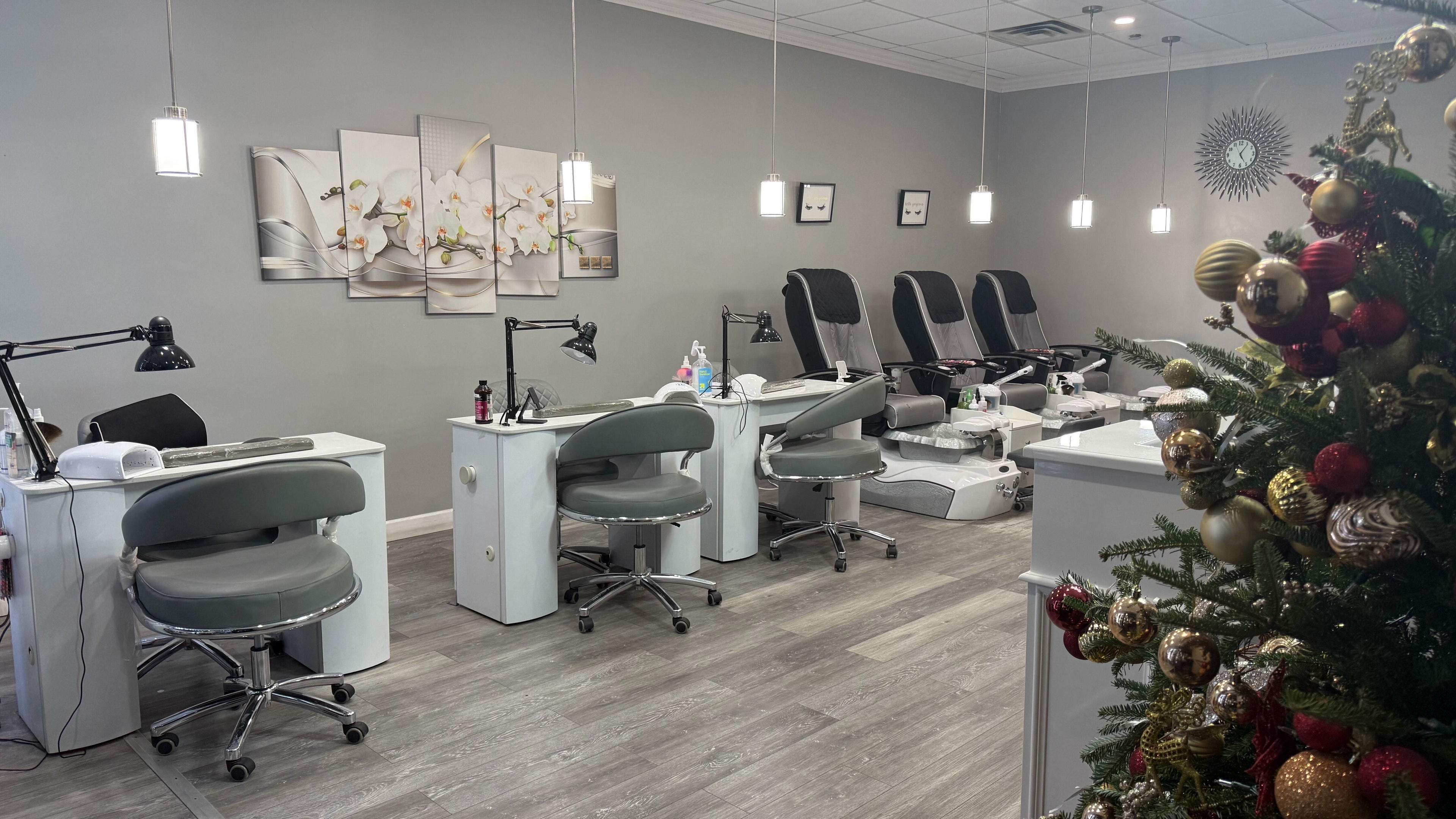 Modern nail salon setup at Ellen's Spa, New Rochelle, New York, US, with festive decor.