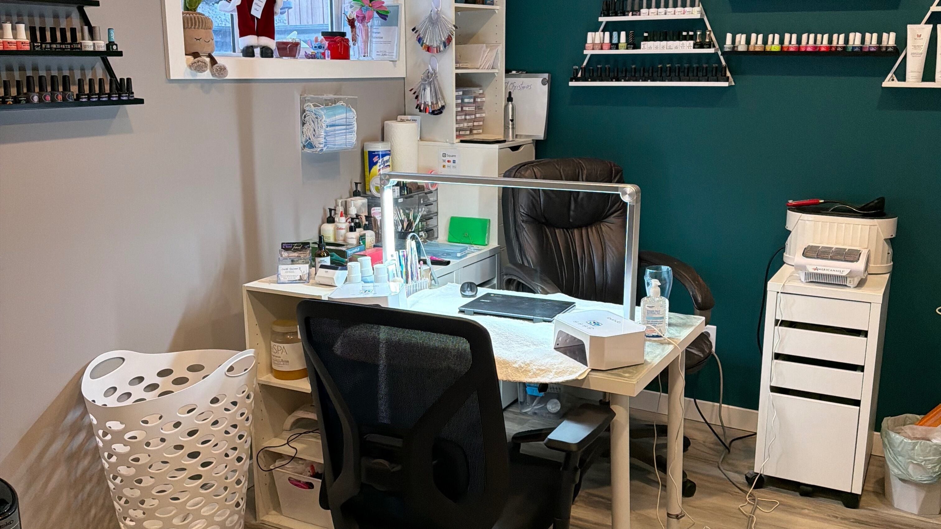 Evolving Beauty's vibrant nail station in Calgary, Alberta, CA showcases professional tools and polish selection.