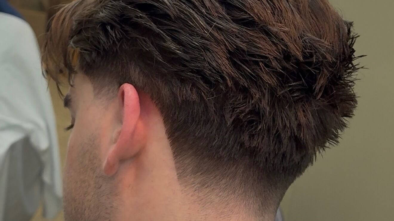 A stylish tapered haircut at Sam Sheppard Hair in Royal Tunbridge Wells, England, GB.