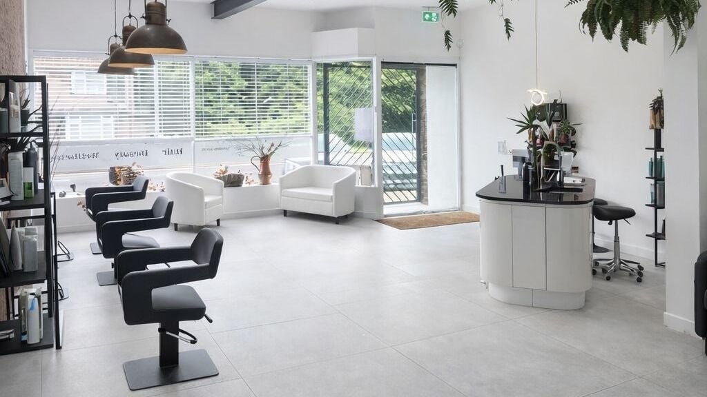 Spacious modern salon interior at The Hair Chair at White Cat Studio, Cardiff, Wales, GB, featuring sleek design.