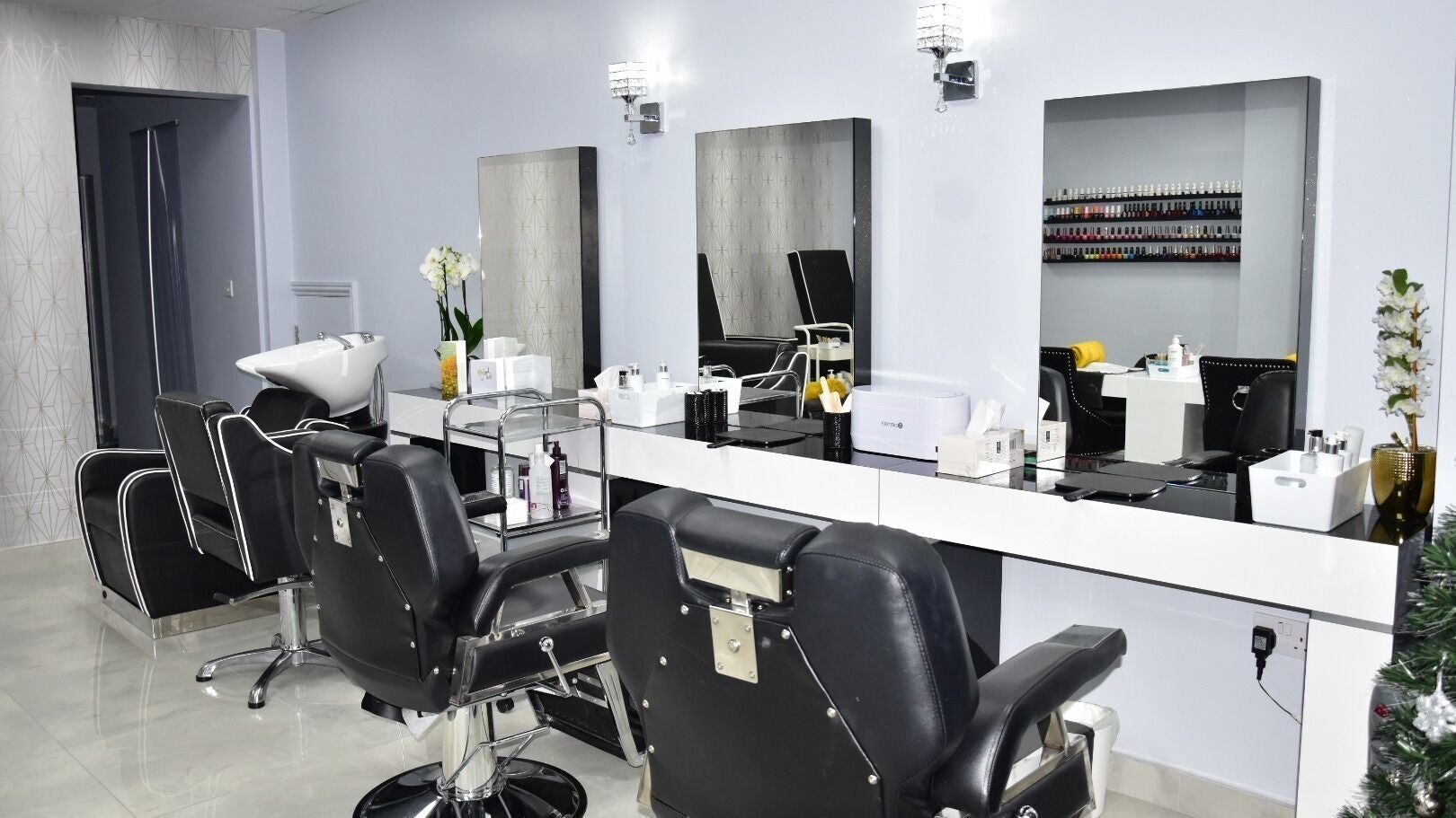 Stylish salon chairs and mirrors at Touch And Glow Beauty Clinic, Edgware, England, GB.