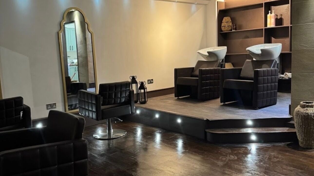 Modern salon chairs and washing stations at KW hair, Clarkston, Scotland, GB, offering a stylish ambiance.