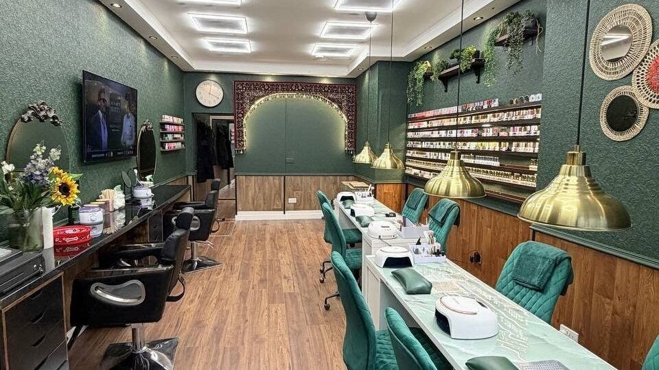 Interior of Emerald Nails, hair & Beauty in Glasgow, Scotland, GB, featuring elegant decor and styling stations.