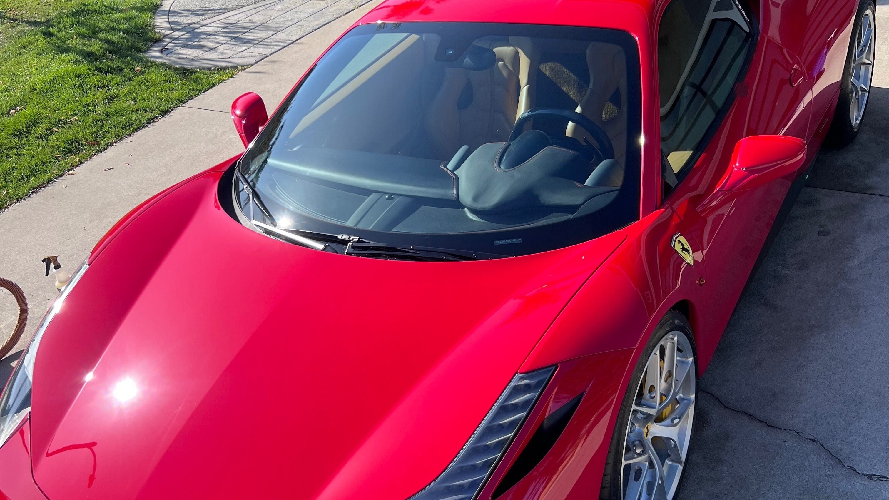 Sleek red sports car detailed by Onsite Luxe Detail Solutions in Chino, California, US.