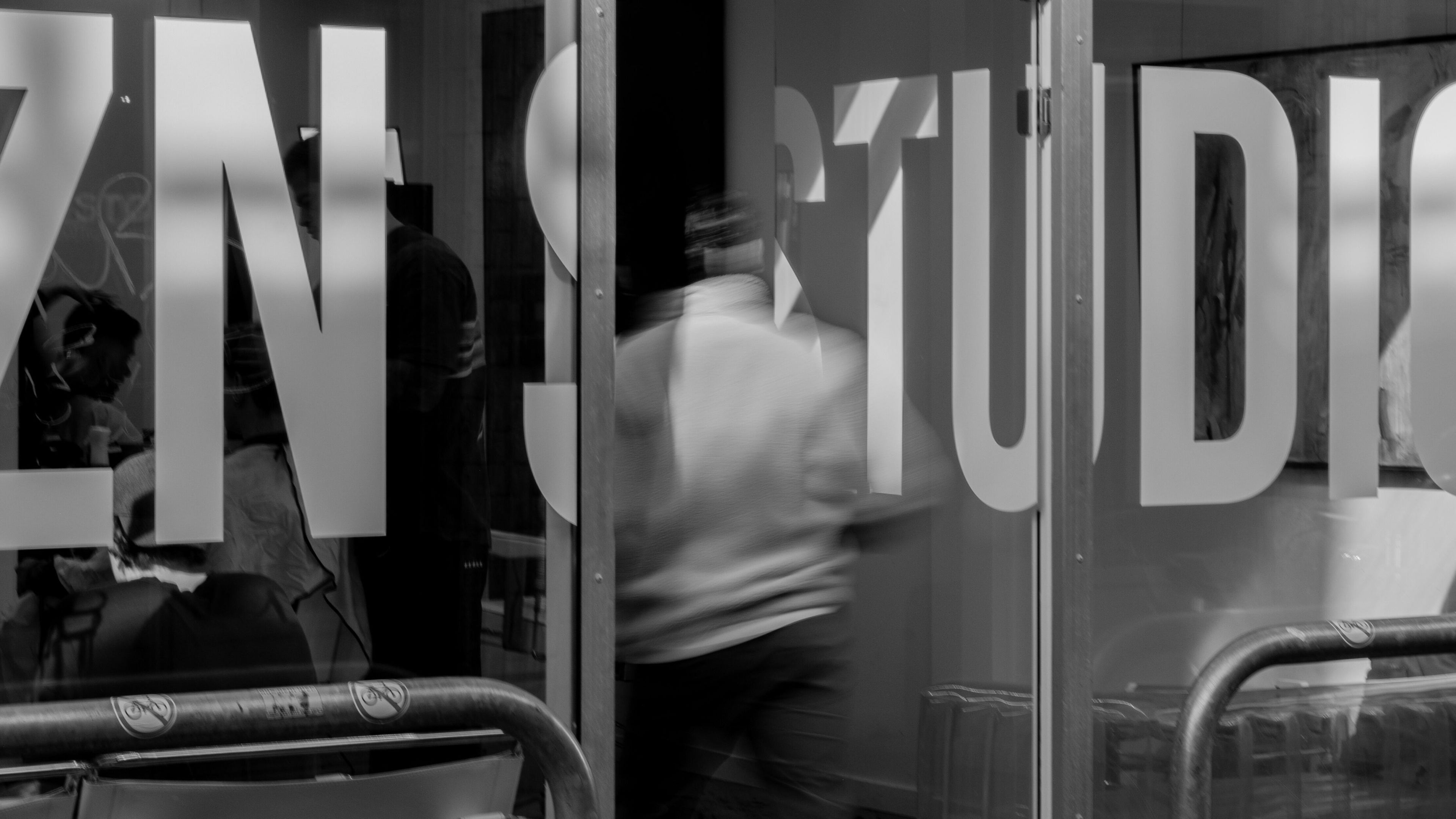Entrance view of CZN STUDIOS CENTRE in Amsterdam, Noord-Holland, NL, featuring stylish glass door signage.