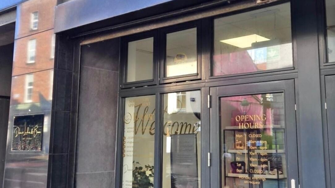 Entrance of Lunea in Limerick, County Limerick, IE, displaying welcoming signage and opening hours on glass doors.