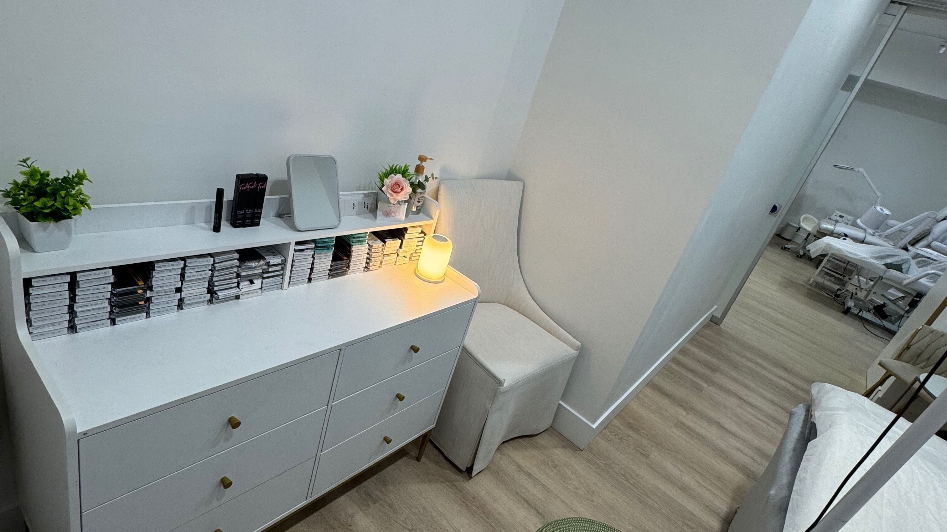 Calming interior of AYLA LASH STUDIO, New York, featuring organized beauty supplies and a relaxing chair.