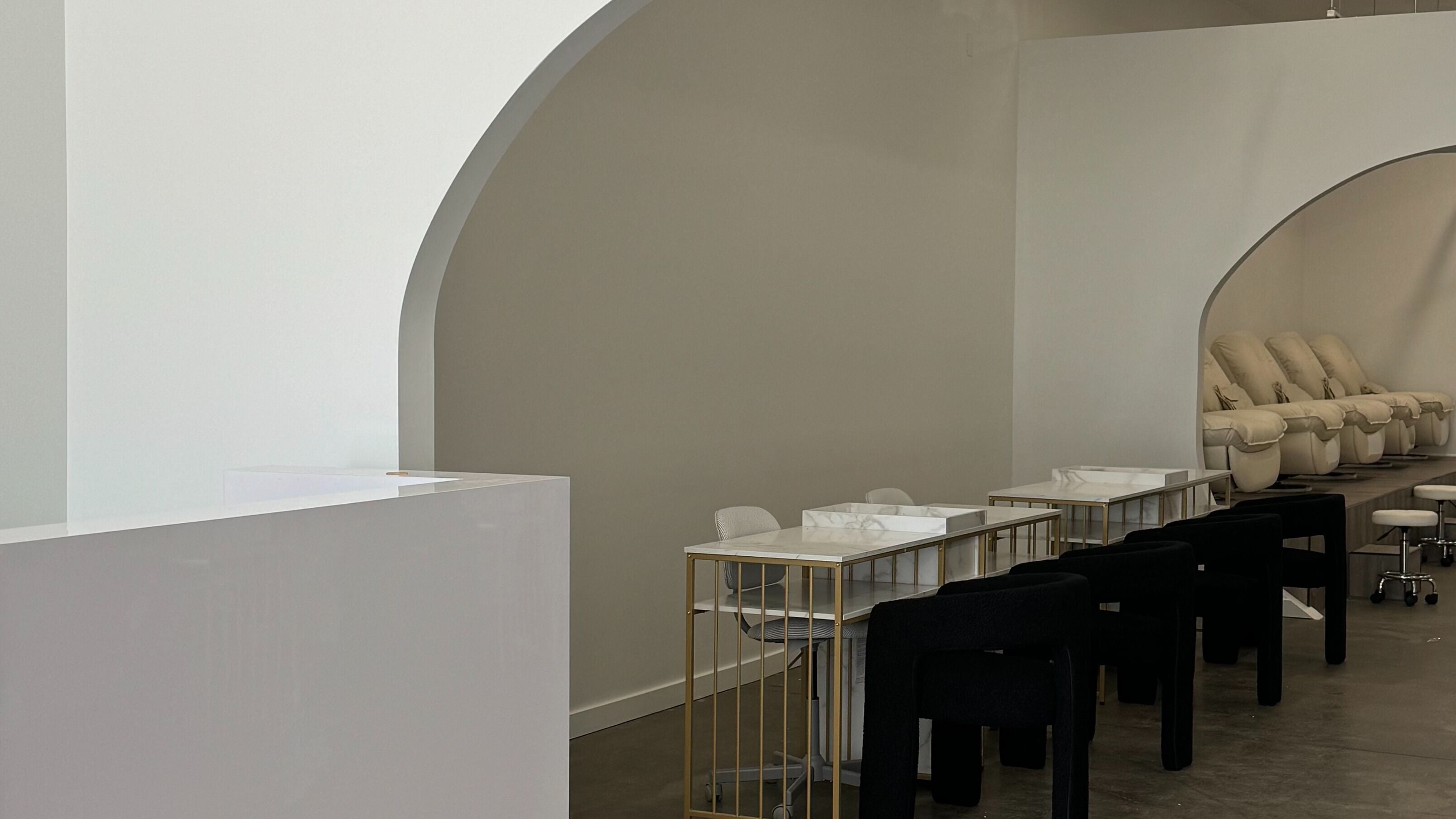 Modern interior of Jolli Nail Studio, featuring sleek manicure stations in Chicago, Illinois, US.