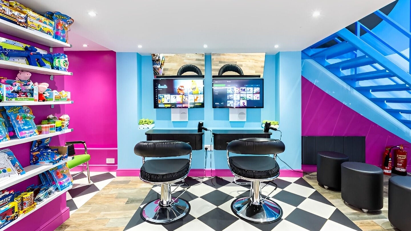 Cool Cuts for Kids salon in London, England, GB with colorful decor and kids' activity area.