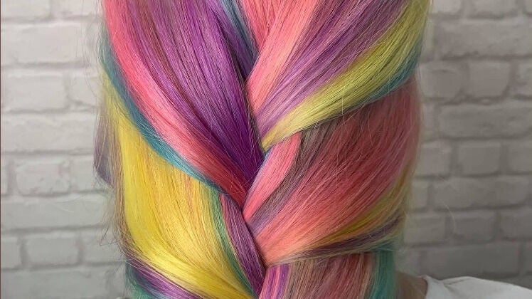 Vibrant rainbow braid styled at Amber Elizabeth Hairdressing in Greenock, Scotland, GB.