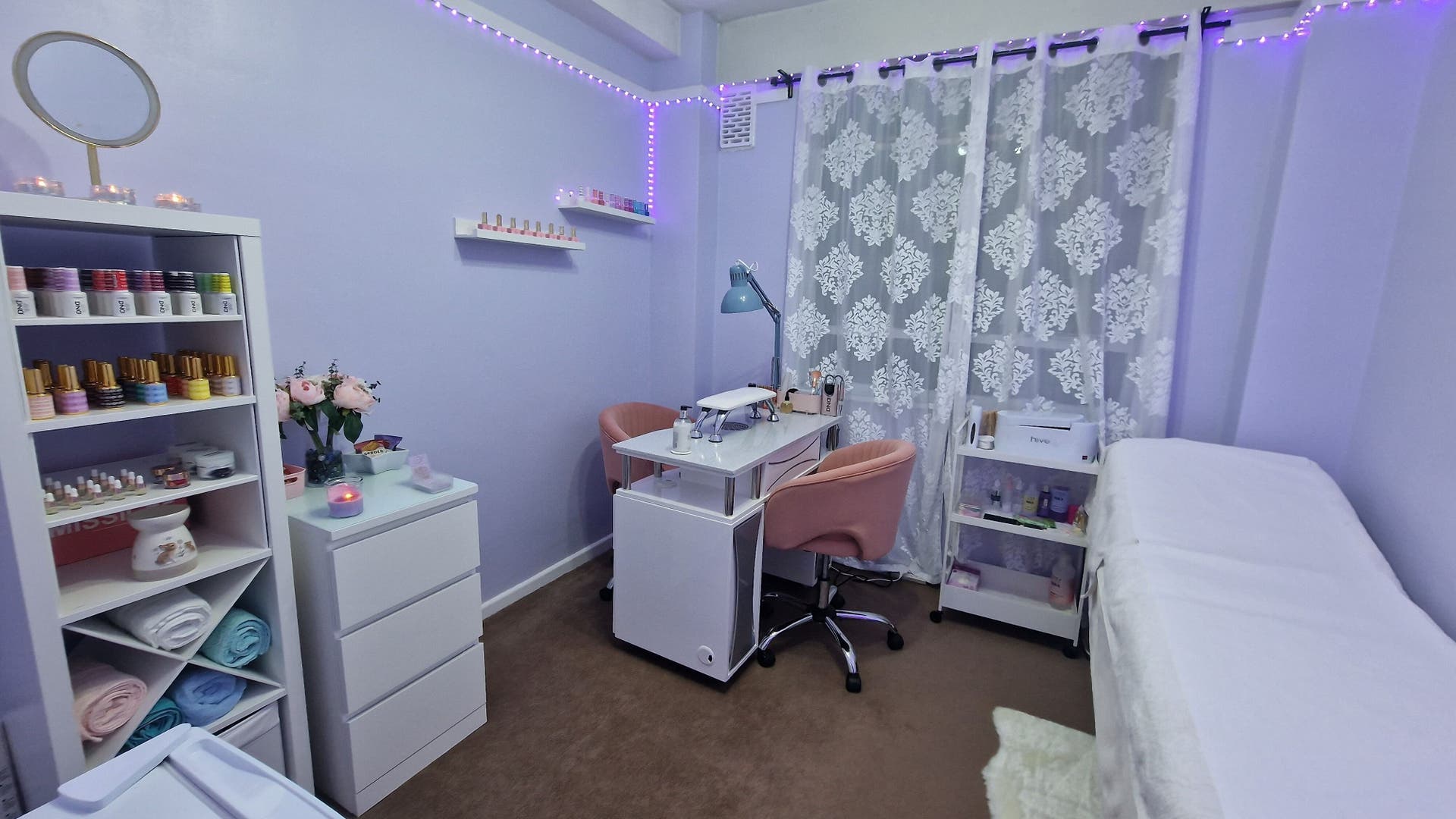 SG Secrets' serene beauty room in London, England, GB, featuring luxe decor and inviting treatment spaces.